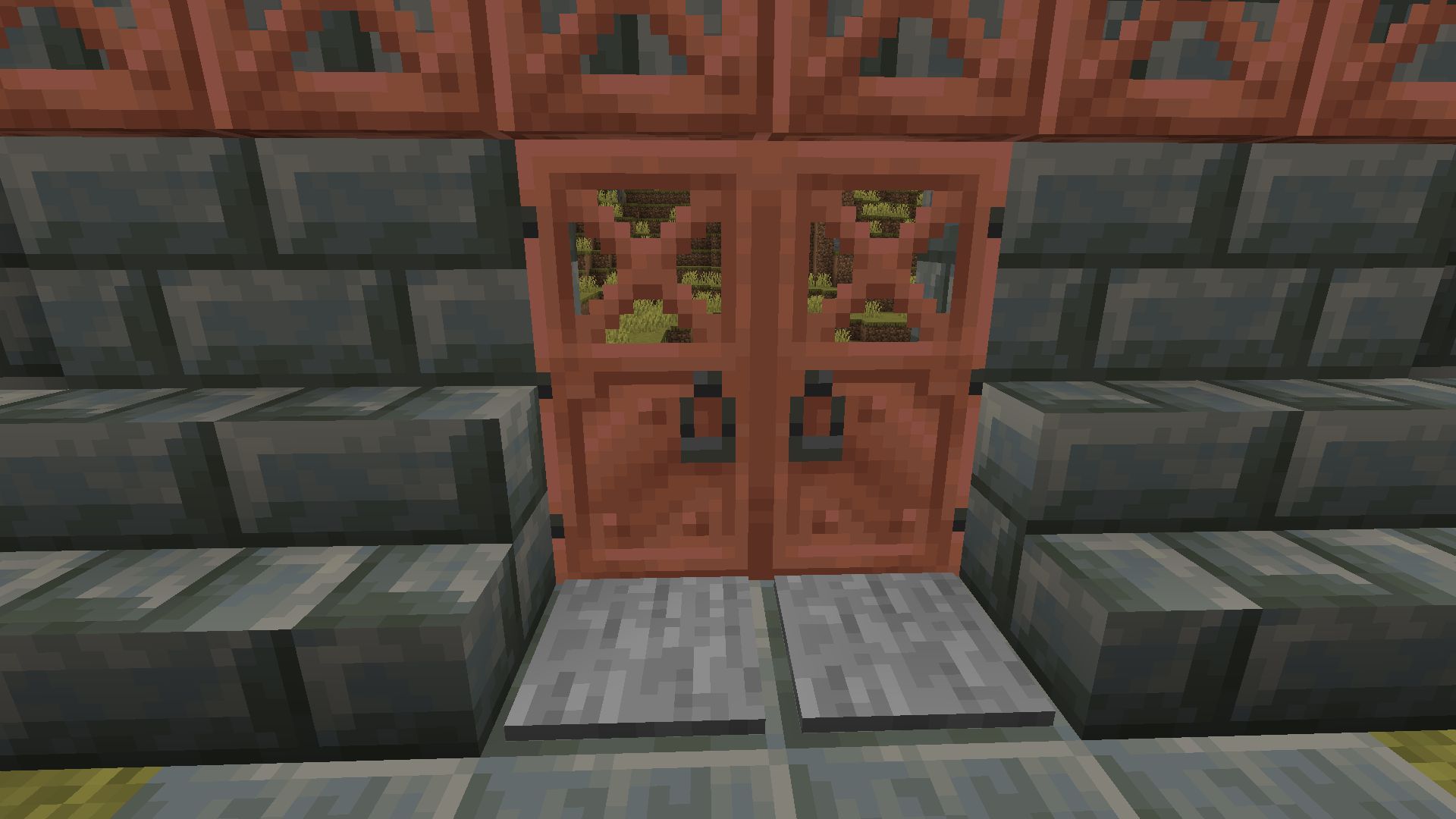 Copper doors used in a tuff wall (Image via Mojang)