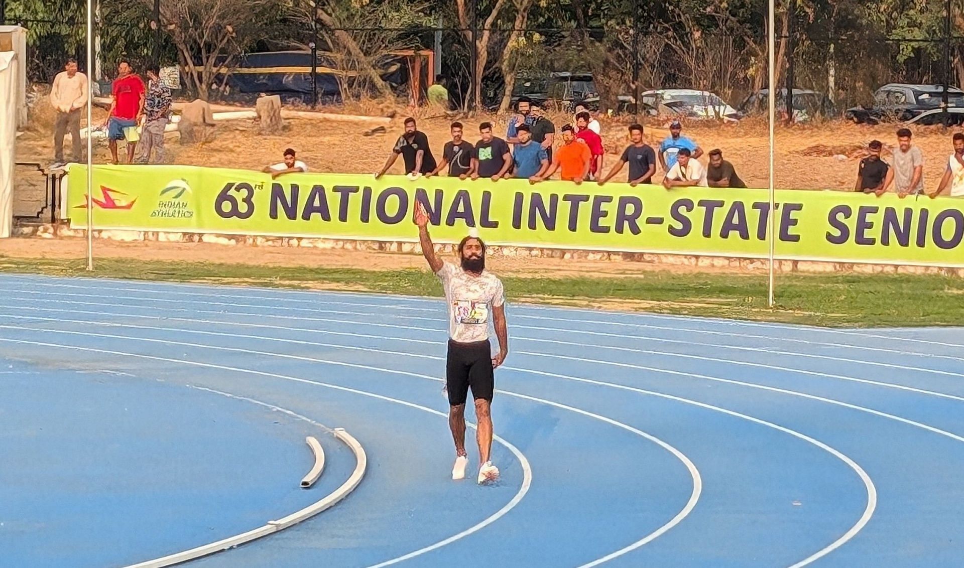 Gurinderveer Singh after winning the 100m final at the Tua Devi Lal Stadium in Panchkula. (Image: Sportskeeda)