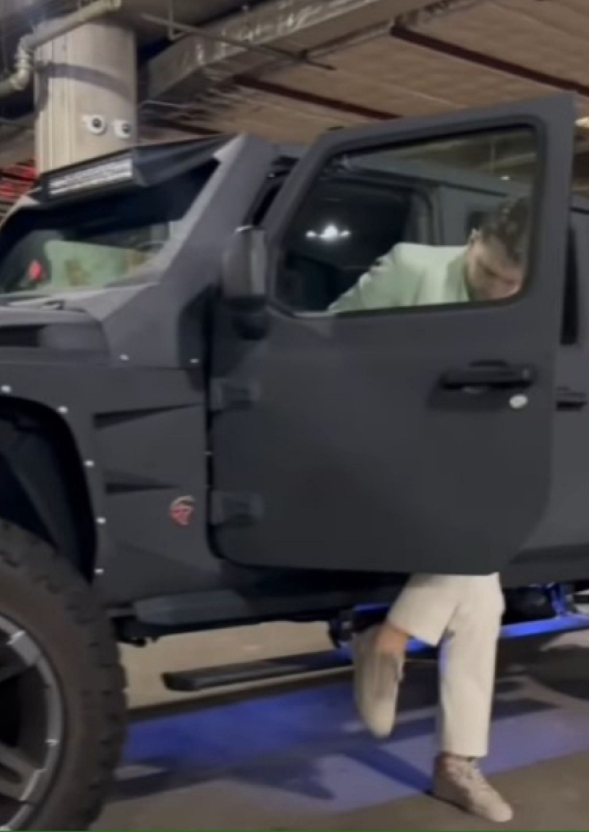 Doncic steps out of his $250k vehicle for Game 3,