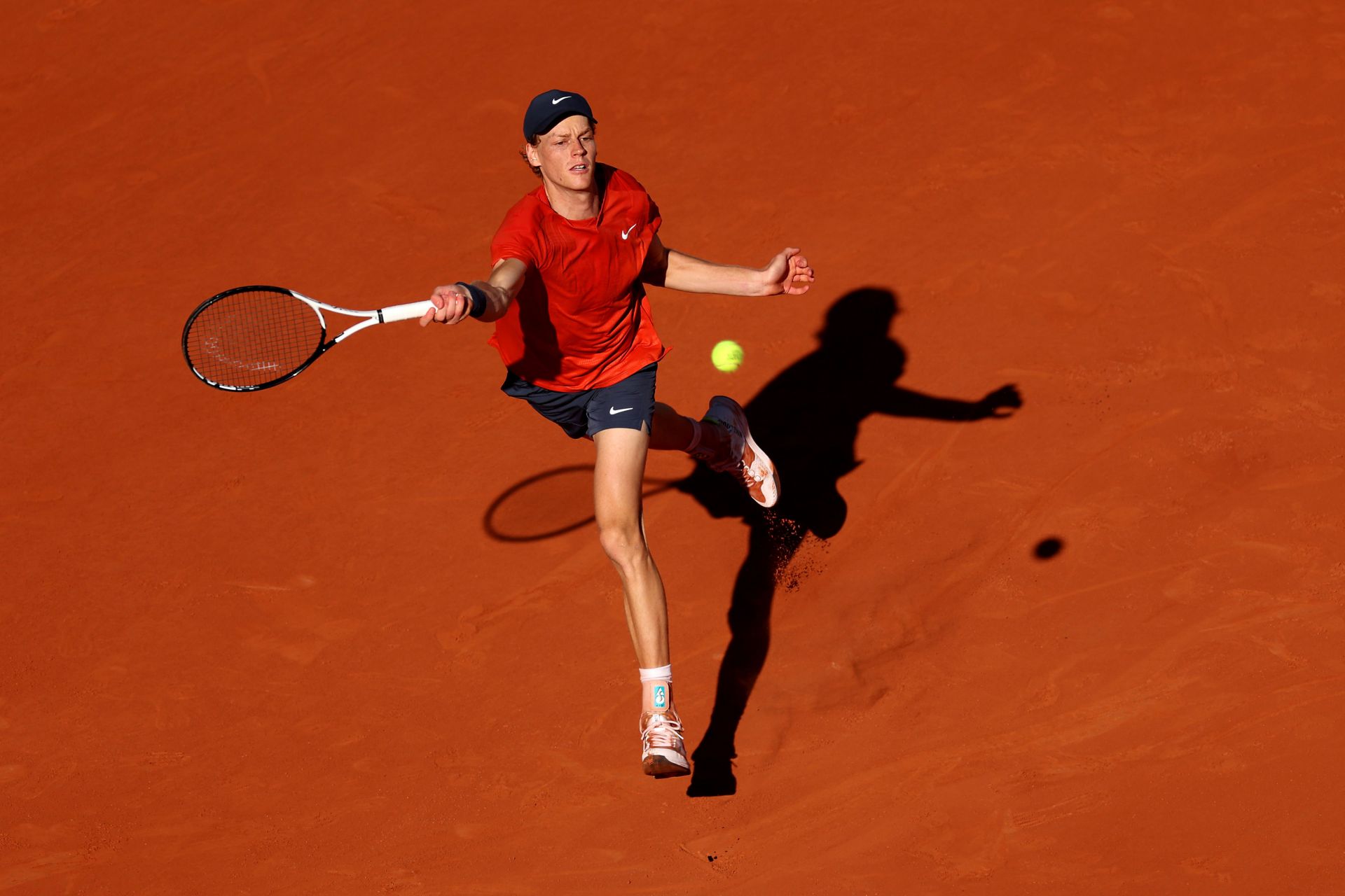 Jannik Sinner hits a ball at the 2024 French Open