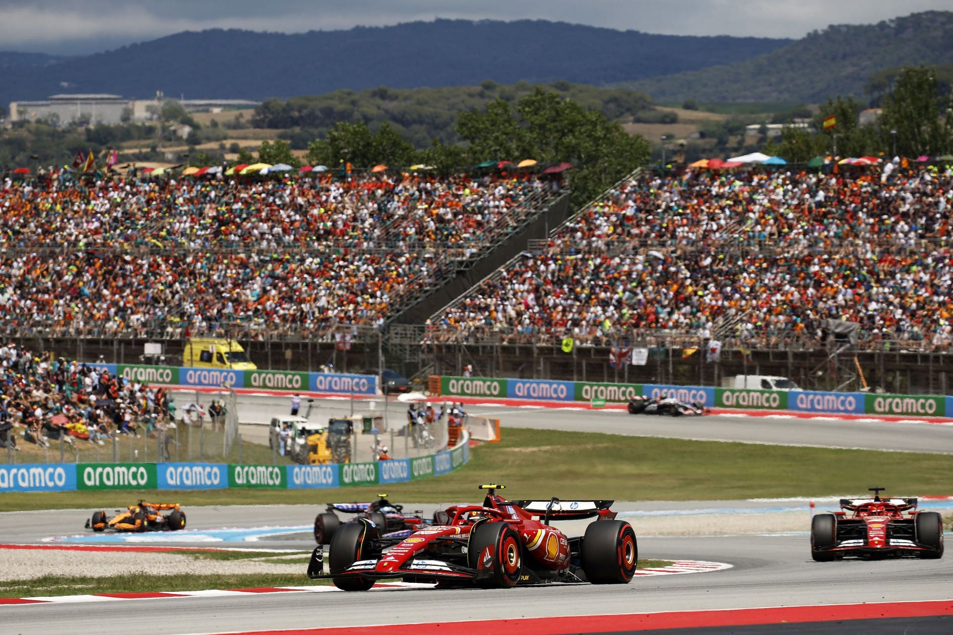 Carlos Sainz of Spain driving (55) the Ferrari SF-24 leads Charles Leclerc of Monaco driving the (16) Ferrari SF-24 during the F1 Grand Prix of Spain at Circuit de Barcelona-Catalunya