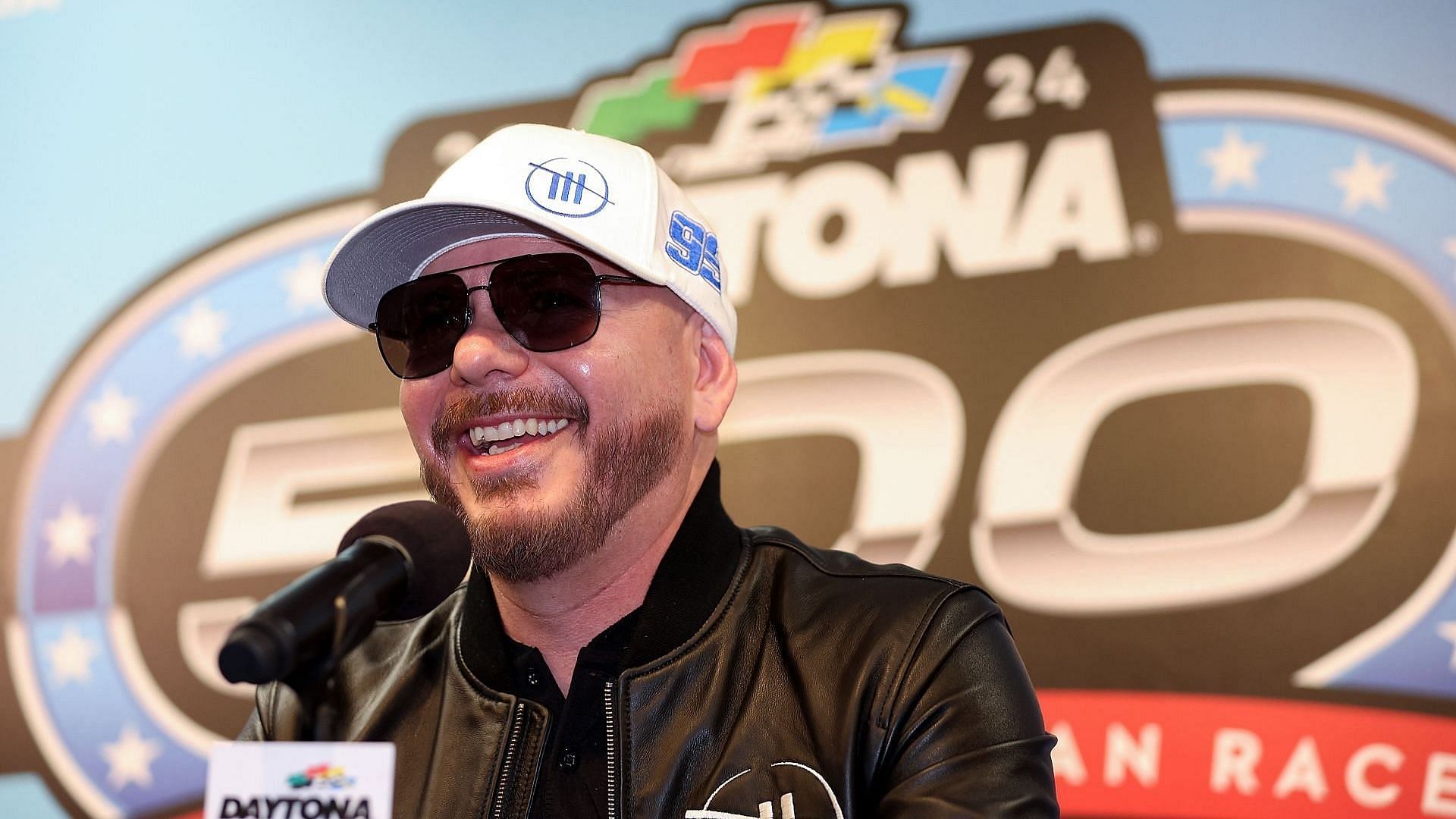 Singer and Trackhouse Racing Team co-owner Pitbull speaks to the media during a press conference after the NASCAR Cup Series Daytona 500 was postponed due to weather at Daytona International Speedway on February 18, 2024, in Daytona Beach, Florida. (Photo by Adam Glanzman/Getty Images)