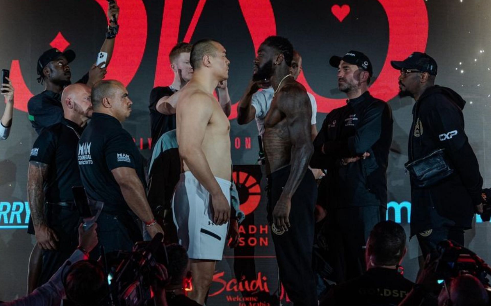 Zhilei Zhang (left) and Deontay Wilder (right) face off ahead of their matchup at Queensberry vs. Matchroom [Photo Courtesy @zhileibigbangzhang on Instagram]