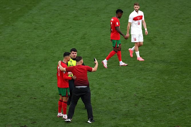"It's dangerous" - Roberto Martinez hits out at pitch invaders after Cristiano Ronaldo was mobbed by fan in Portugal vs Turkey clash