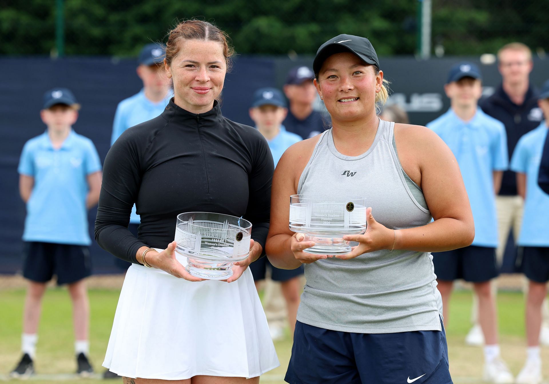 Tara Moore (R) posing with runners-up trophy at ITF Great Britain 07A