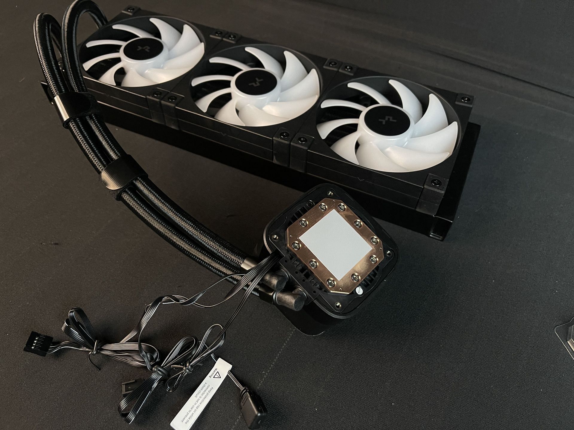 Cables coming off the pump block of the DeepCool LD360 (Image via Sportskeeda)