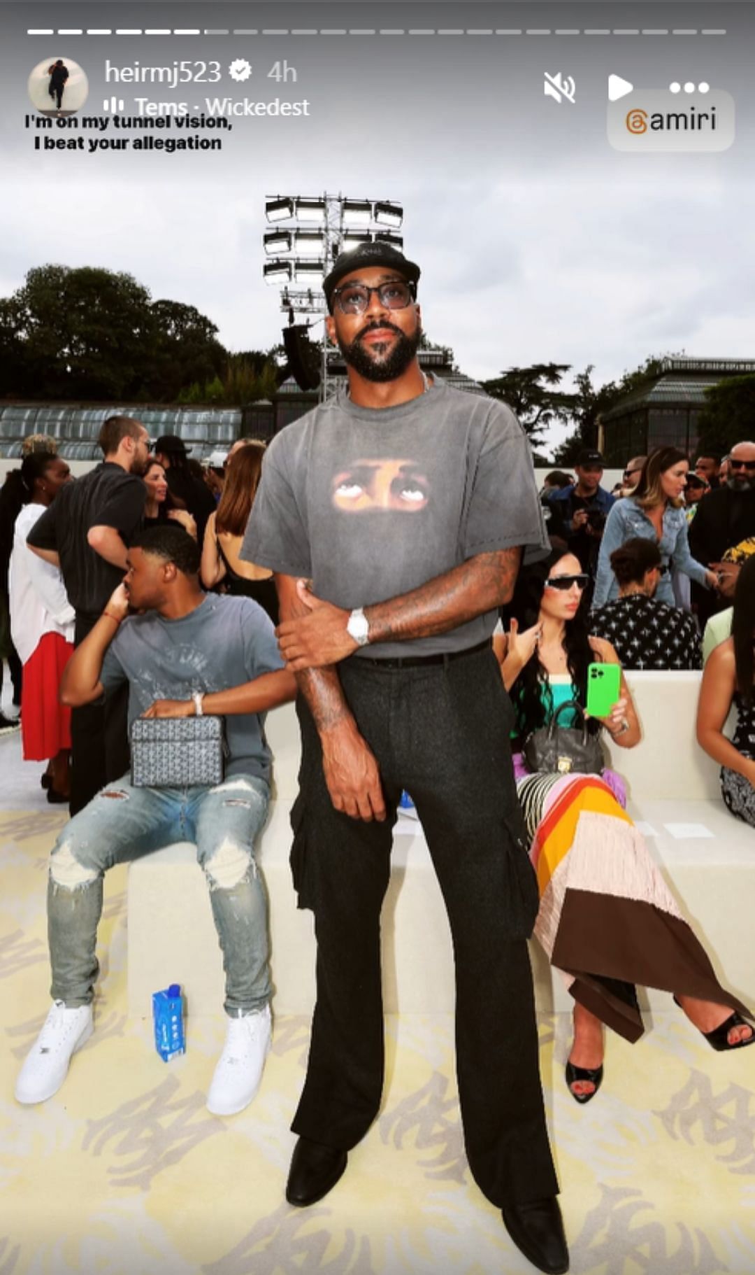 Marcus rocks an all-black ensemble at the Amiri fashion show