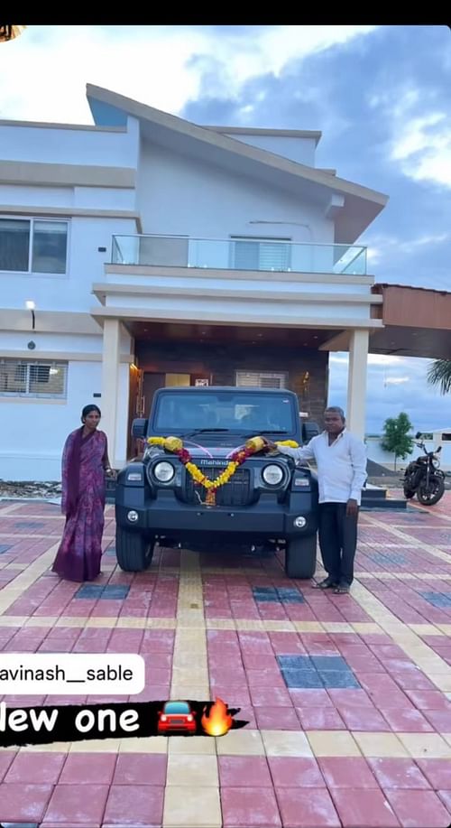 Avinash Sable's parents with the car. (Image Credit: Instagram)