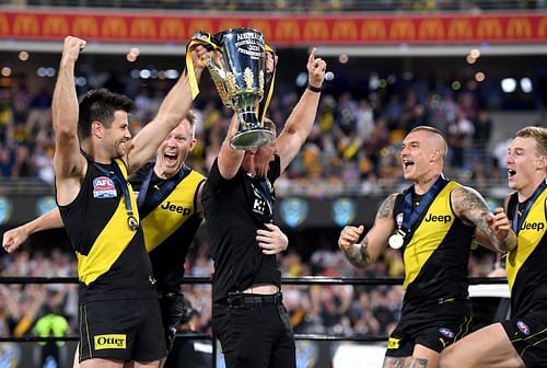 Coach Damien Hardwick, Trent Cotchin, Jack Riewoldt, Dustin Martin, and Tom J. Lynch of the Tigers celebrate victory after the 2020 AFL Grand Final match