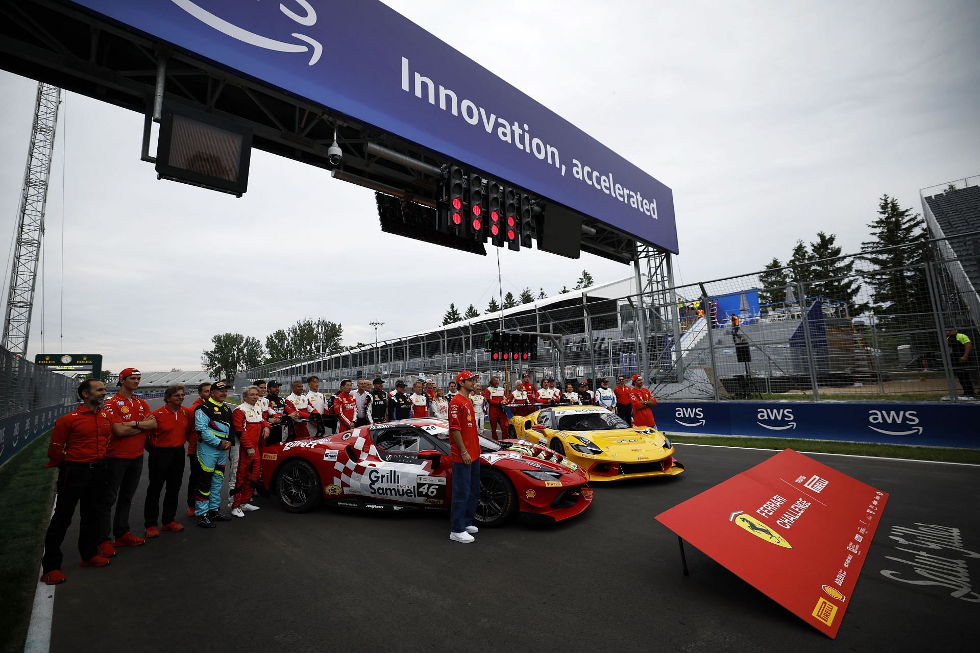 F1 Grand Prix of Canada - Previews MONTREAL, QUEBEC - JUNE 06: Charles Leclerc of Monaco and Ferrari and Carlos Sainz of Spain and Ferrari pose for a photo with the field of the Ferrari Challenge during previews ahead of the F1 Grand Prix of Canada at Circuit Gilles Villeneuve on June 06, 2024 in Montreal, Quebec. (Photo by Chris Graythen/Getty Images)