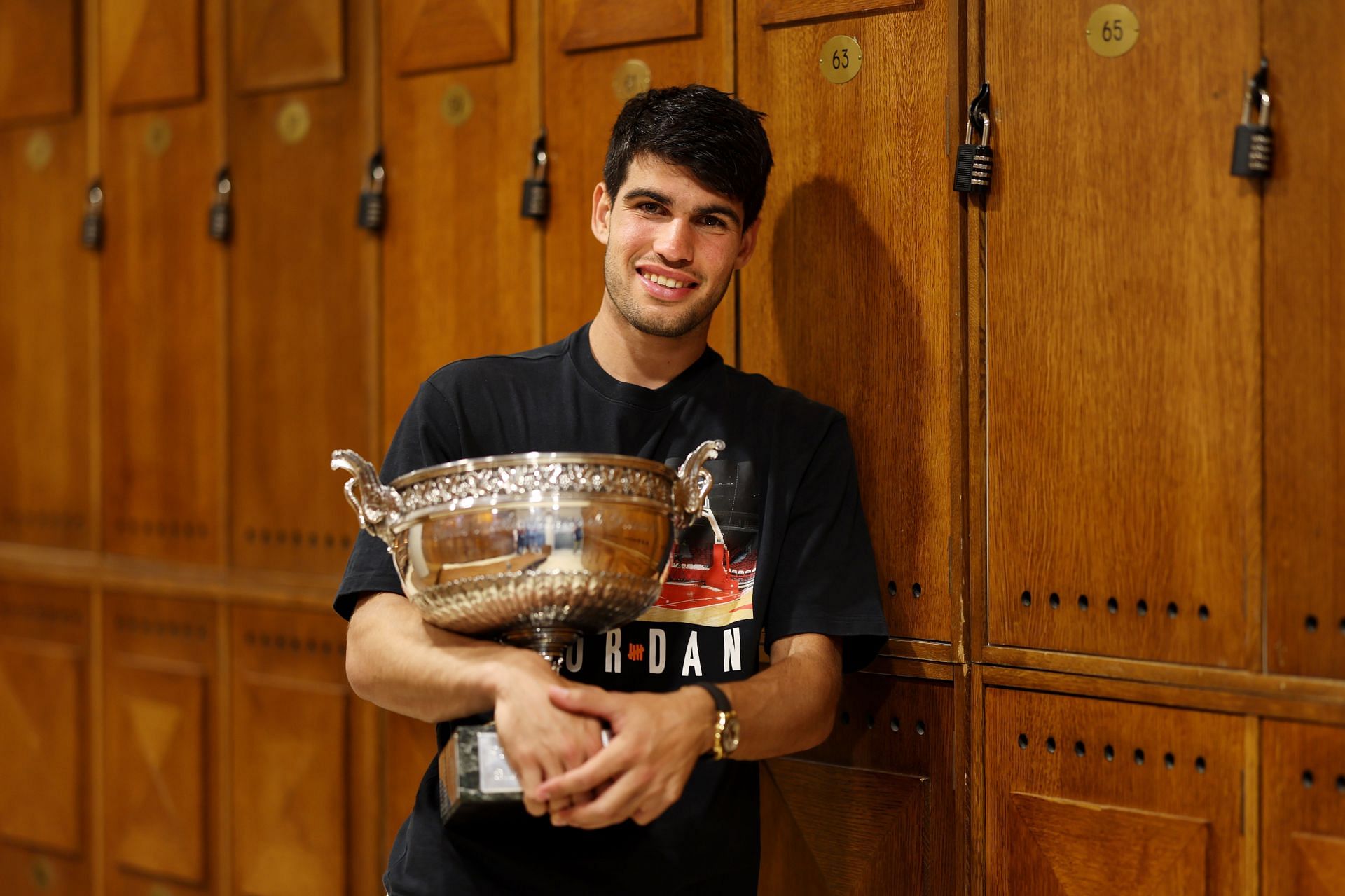 Carlos Alcaraz with the 2024 French Open trophy