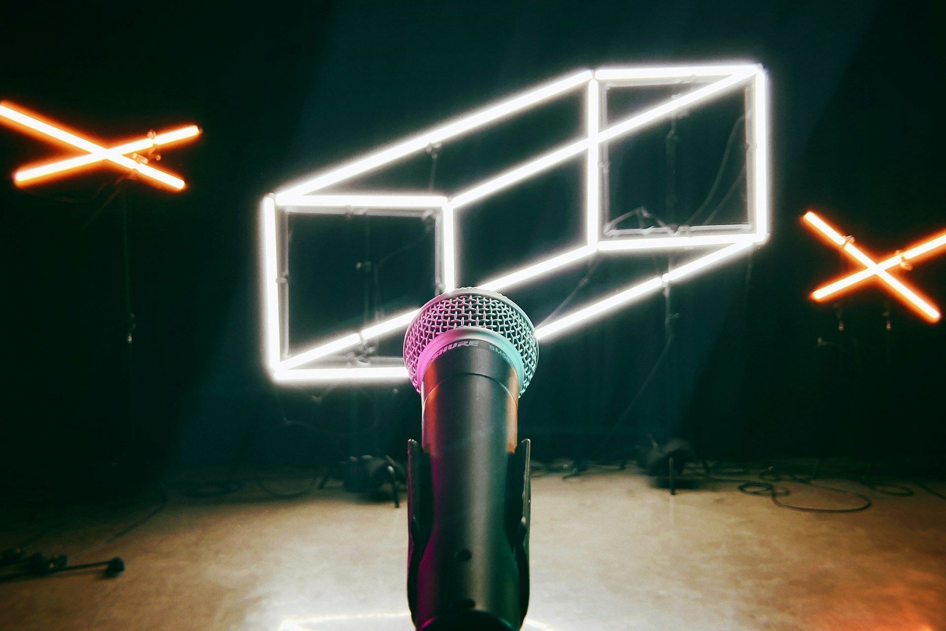 A representative image of a microphone used by stand-up comedians on stage. (Image via Unsplash)