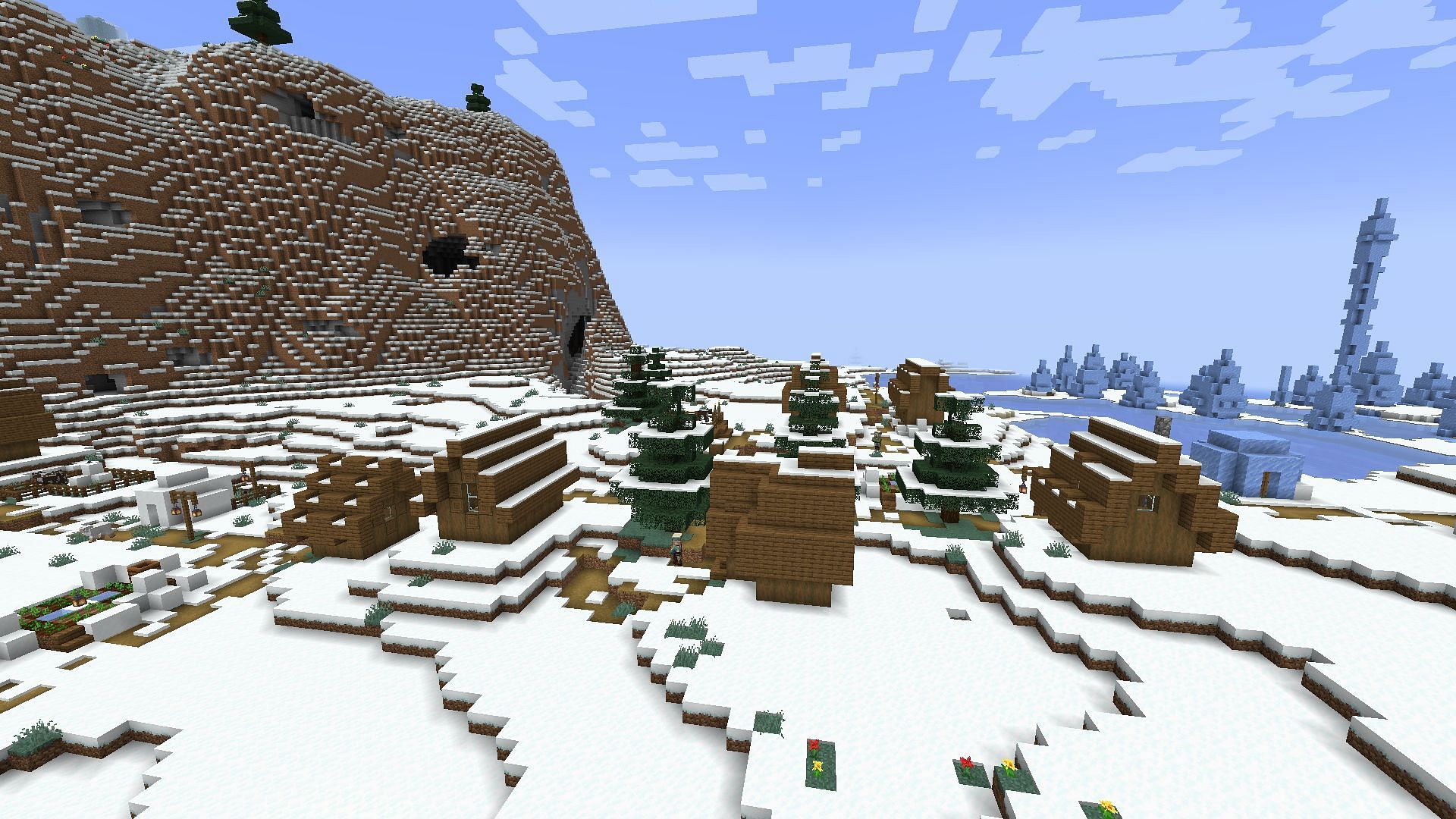 A village and nearby ice spikes biome found on the seed (Image via Mojang)