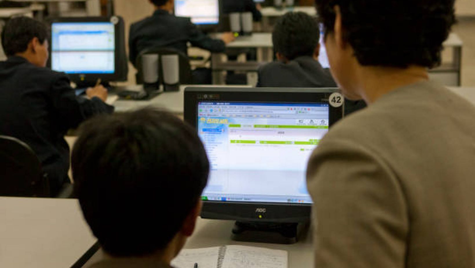 Young men using the internet on a computer in the Grand People&#039;s Study House, Pyongan Province, Democratic People&#039;s Republic of Korea. (Image via GETTY/Eric Lafforgue/Art in All of Us / Contributor)