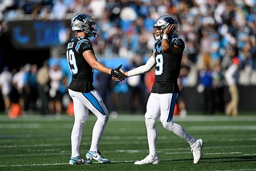 Adam Thielen, left, and Bryce Young, right during Houston Texans v Carolina Panthers