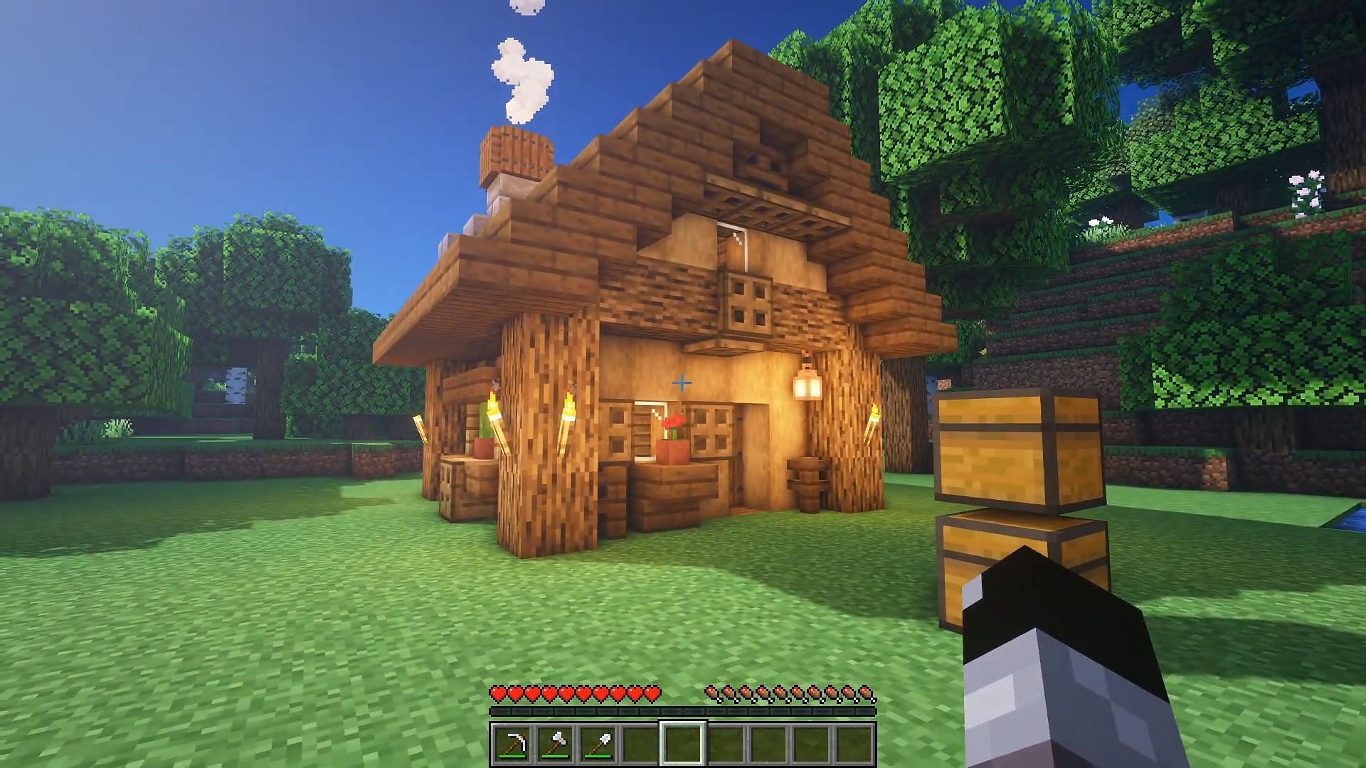 Building in the forest is fun to do in Minecraft (Image via YouTube/Folli)