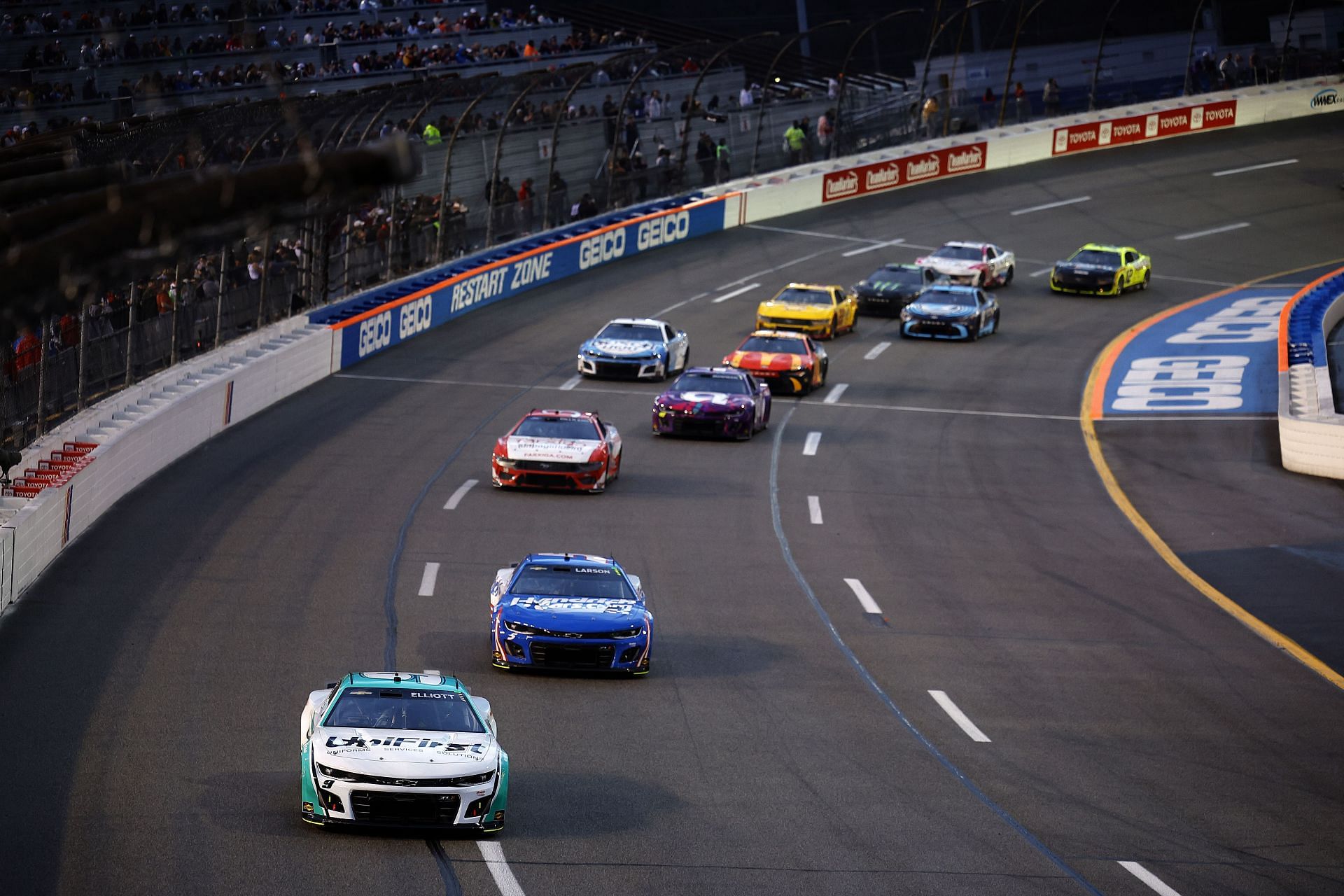 NASCAR Cup Series Toyota Owners 400: Chase Elliott, driver of the #9 UniFirst Chevrolet, and Kyle Larson, driver of the #5 HendrickCars.com Chevrolet, race during the NASCAR Cup Series Toyota Owners 400 at Richmond Raceway - Getty Images