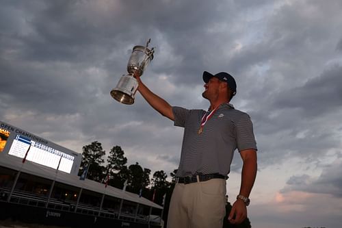 Bryson DeChambeau poses with the trophy after winning the US Open 2024