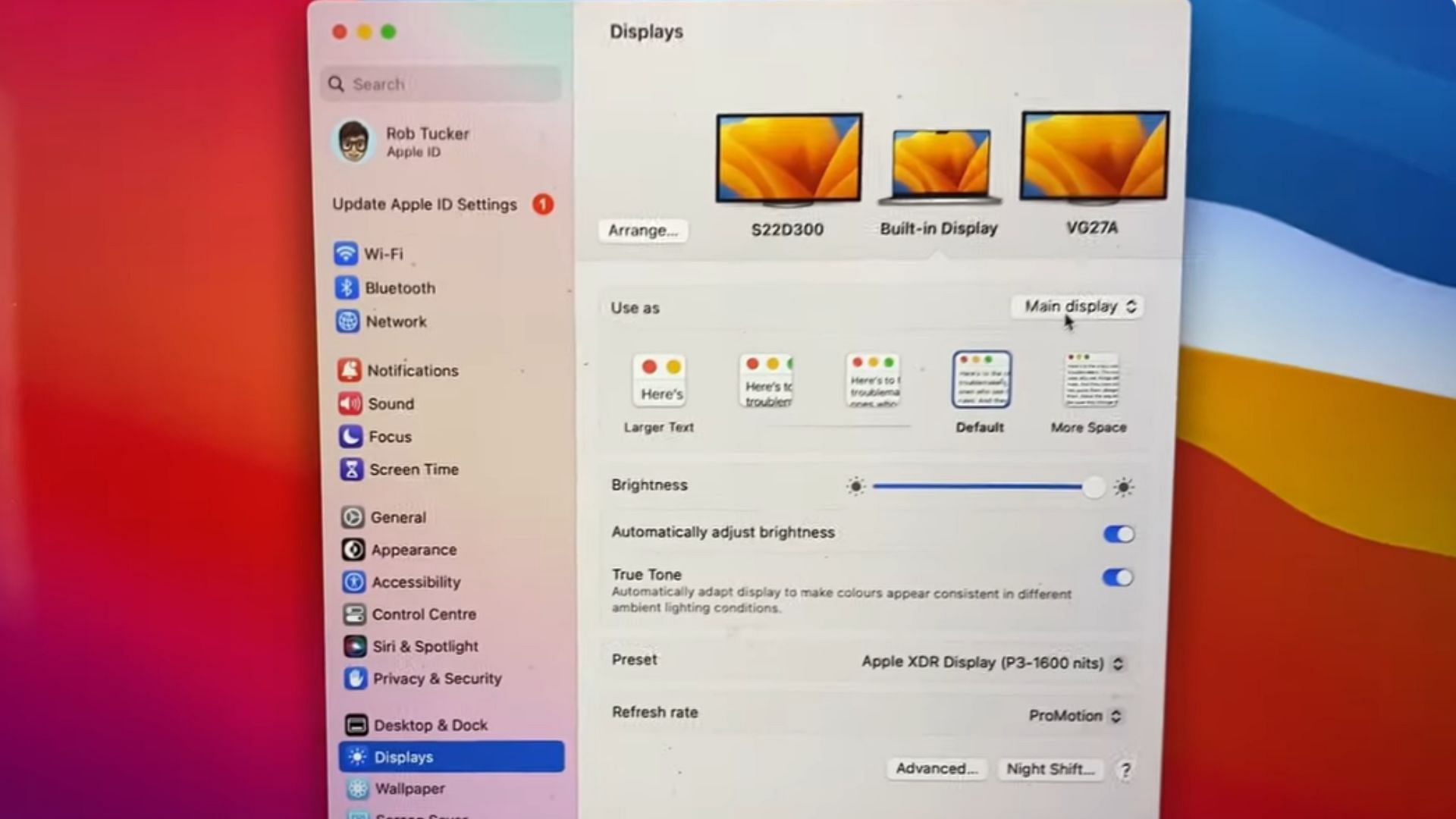 Adjust the settings after connecting dual monitors with MacBook (Image via YouTube/GuideRealm)