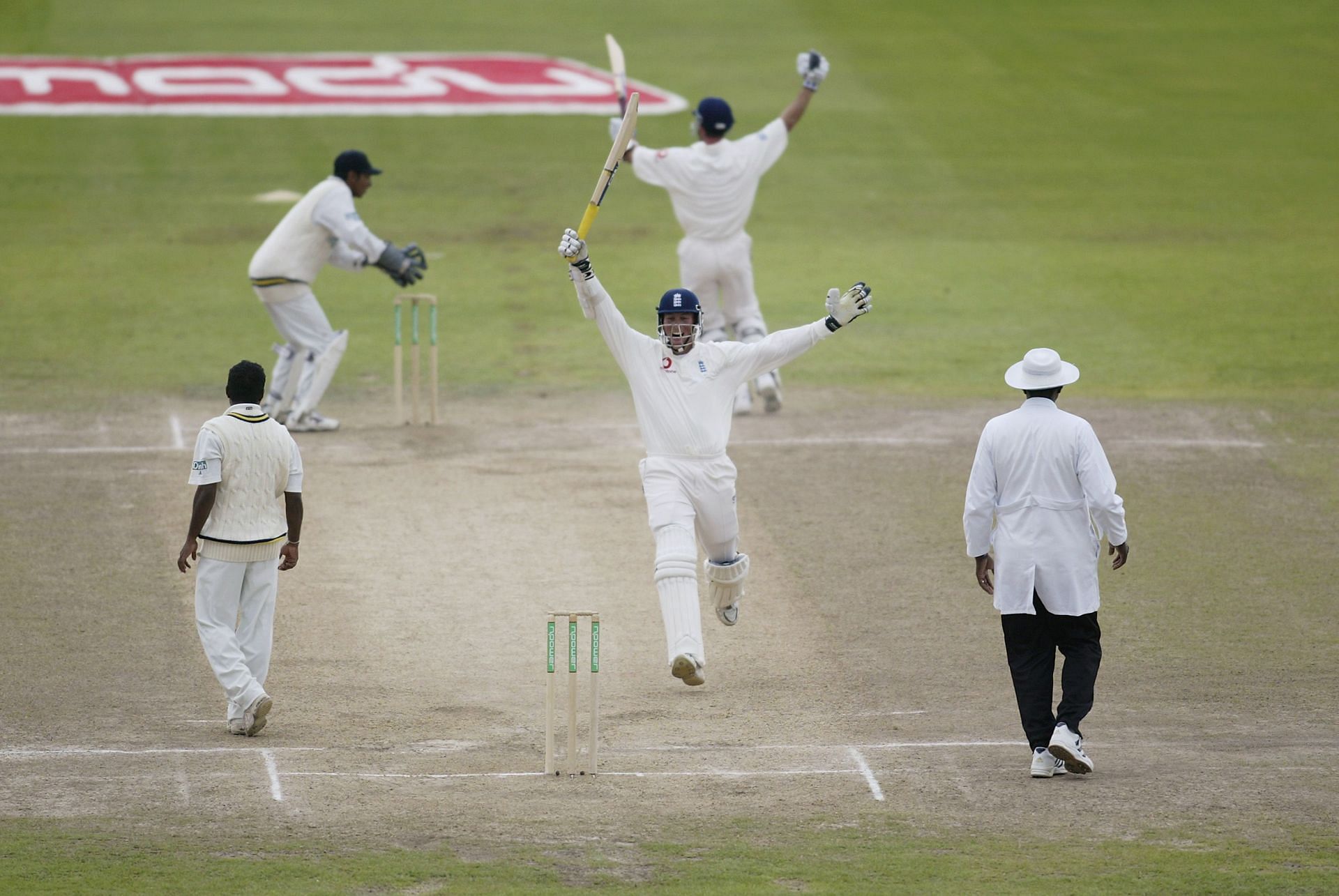 Marcus Trescothick and Michael Vaughan of England celebrate victory