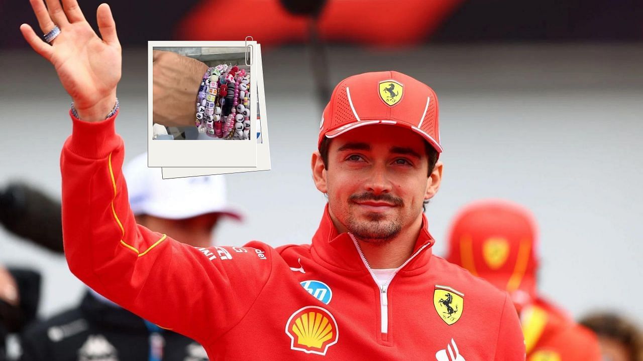 Charles Leclerc waves his hand. Charles Leclerc