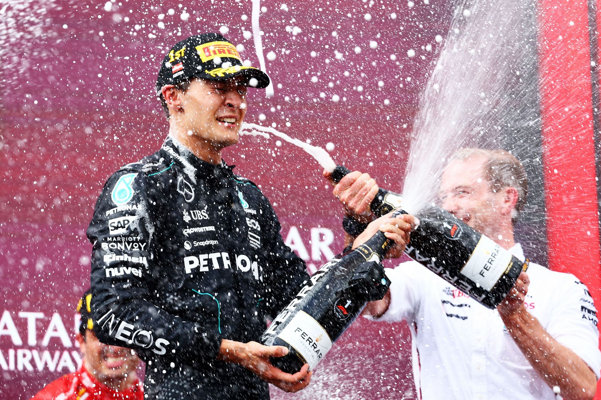 Race winner George Russell of Great Britain and Mercedes celebrates on the podium during the F1 Grand Prix of Austria at Red Bull Ring on June 30, 2024 in Spielberg, Austria. (Photo by Clive Rose/Getty Images)