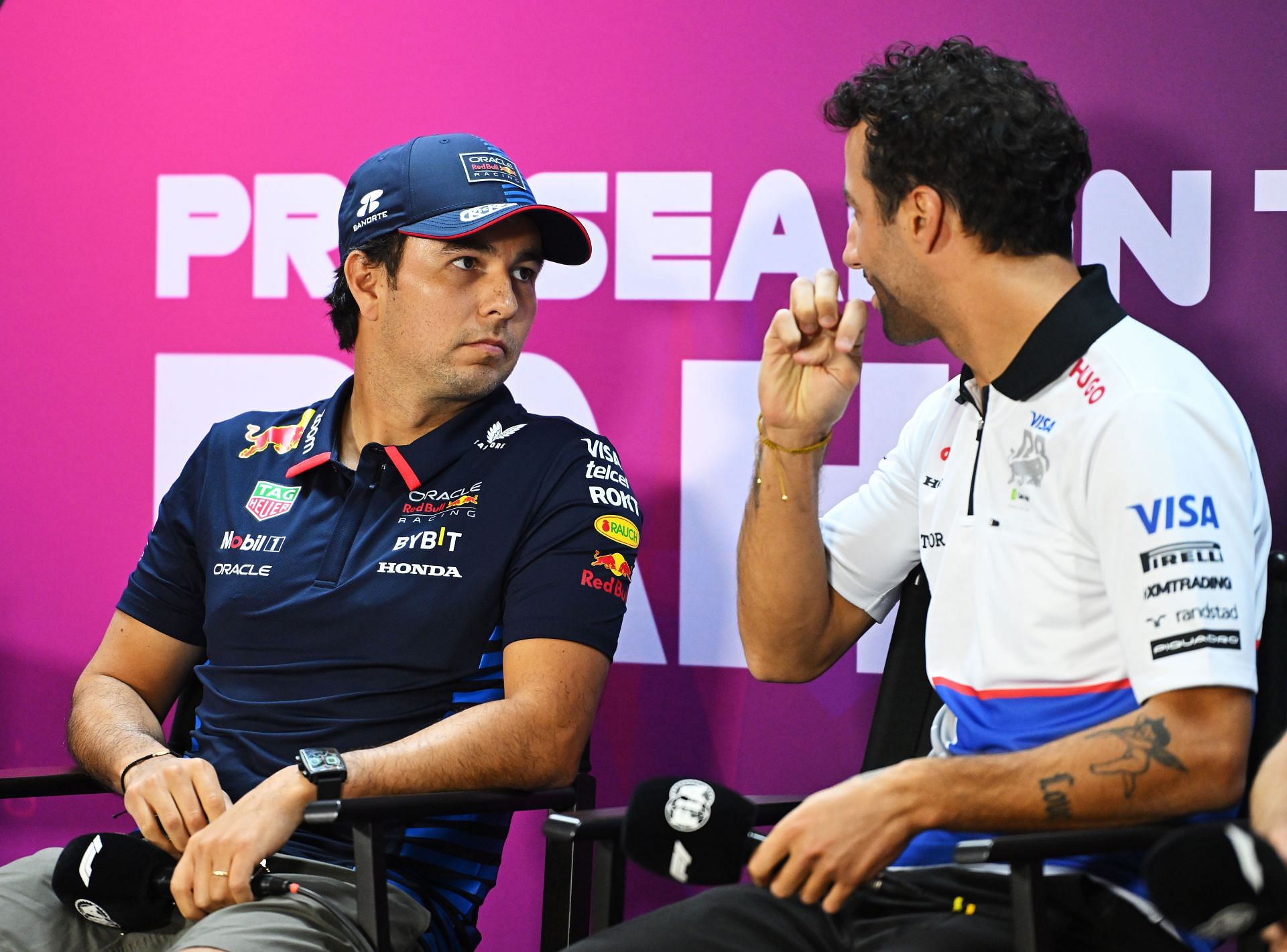 Sergio Perez of Mexico and Oracle Red Bull Racing and Daniel Ricciardo of Australia and Visa Cash App RB attend the Drivers Press Conference. (Photo by Rudy Carezzevoli/Getty Images)