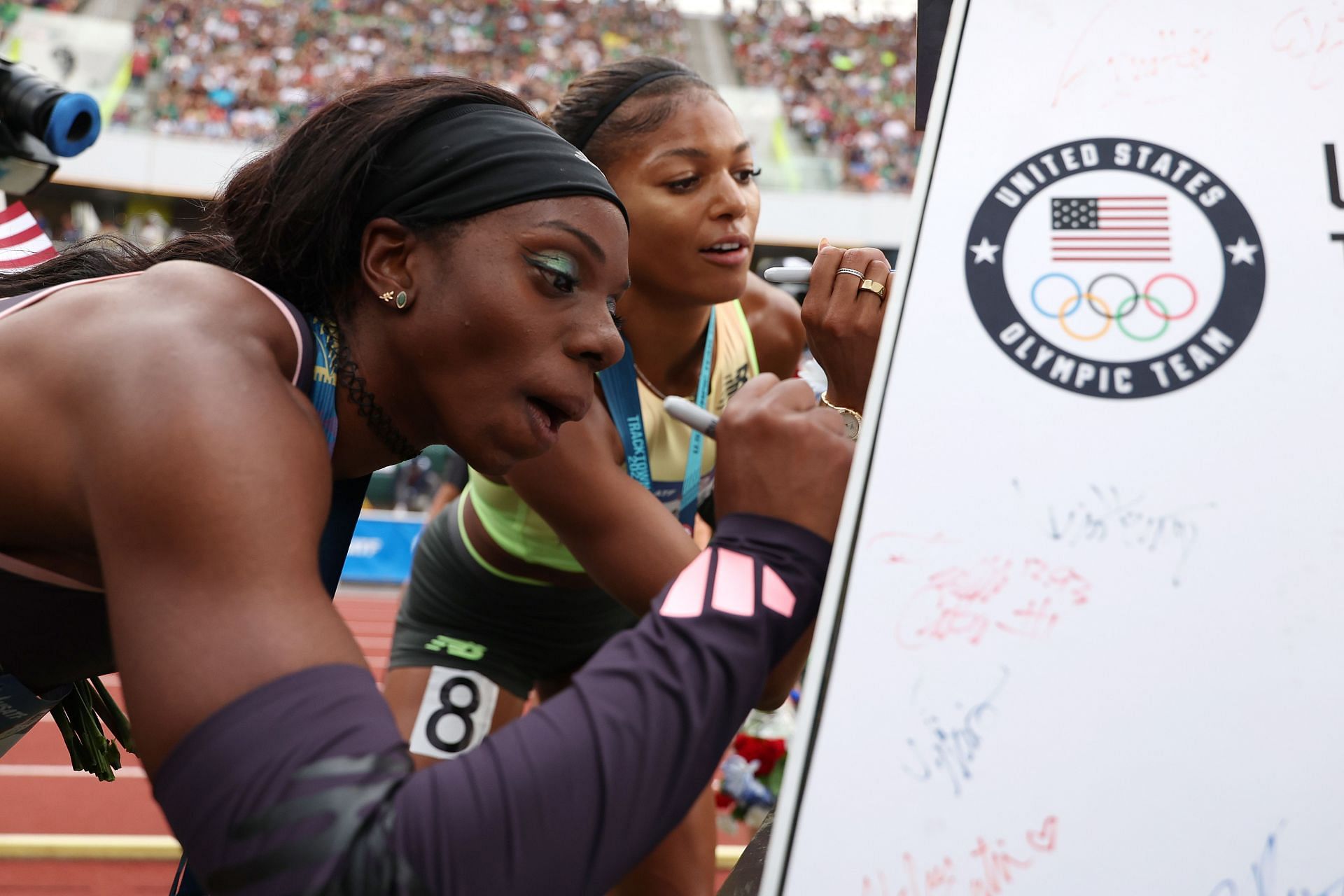 Brittany Brown signs a miniature Eiffel Tower after placing third in the women&#039;s 200-meter final at the 2024 U.S. Olympic Team Track &amp; Field Trials at Hayward Fiel in Eugene, Oregon. (Photo by Getty Images)