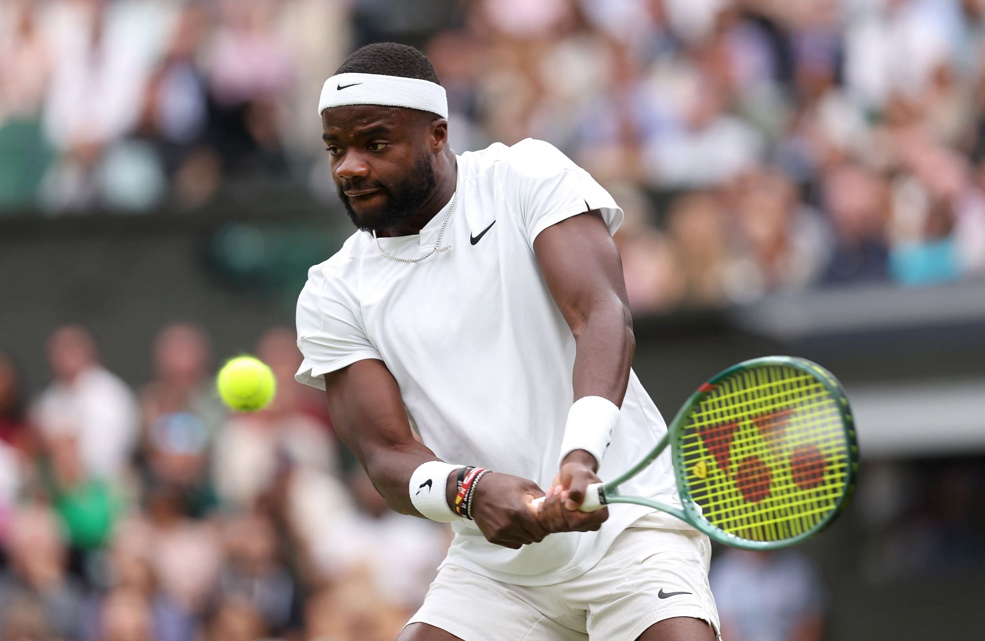 Frances Tiafoe hits a backhand at Wimbledon