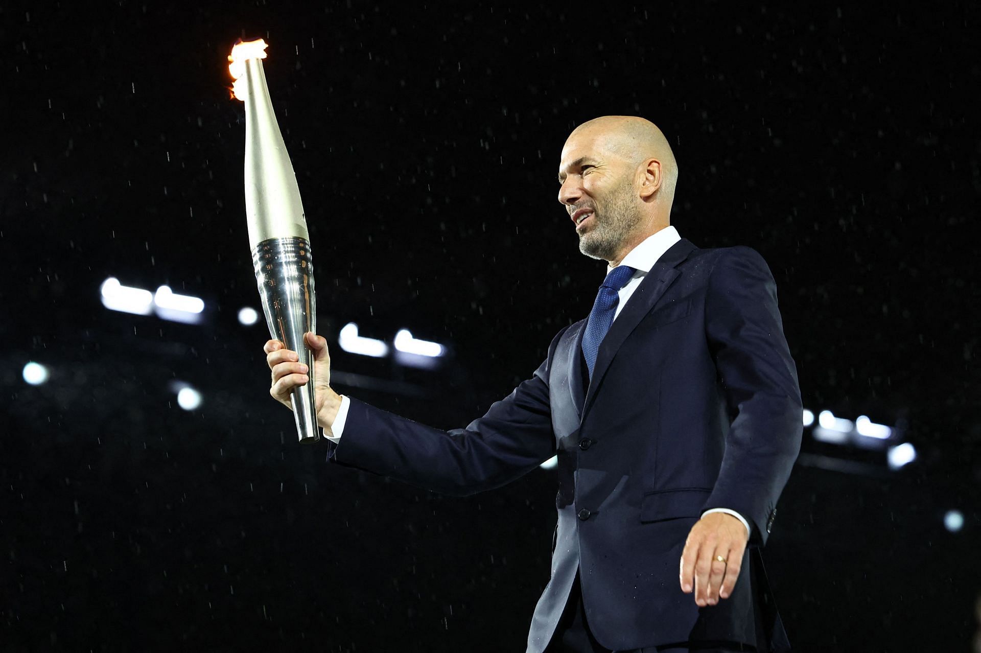 Zinedine Zidane carries the Olympic torch during the Opening Ceremony of the Olympic Games in Paris, France. Source: Getty