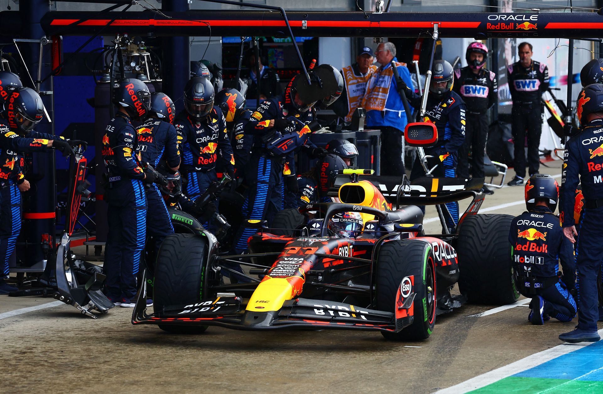 F1 Grand Prix of Great Britain: Sergio Perez of Mexico driving the (11) Oracle Red Bull Racing RB20 makes a pitstop during the F1 Grand Prix of Great Britain at Silverstone Circuit on July 07, 2024 in Northampton, England. (Photo by Mark Thompson/Getty Images)