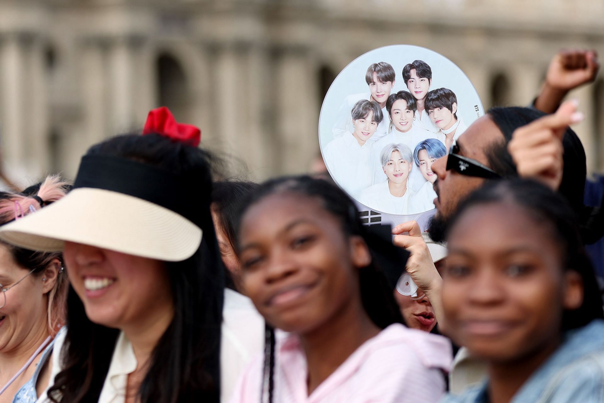 Fans of BTS line up as Kim Seok-jin, a member of South Korean band BTS (not pictured) prepares to carry the Olympic Torch on July 14, 2024, in Paris, France. (Photo by Maja Hitij/Getty Images)