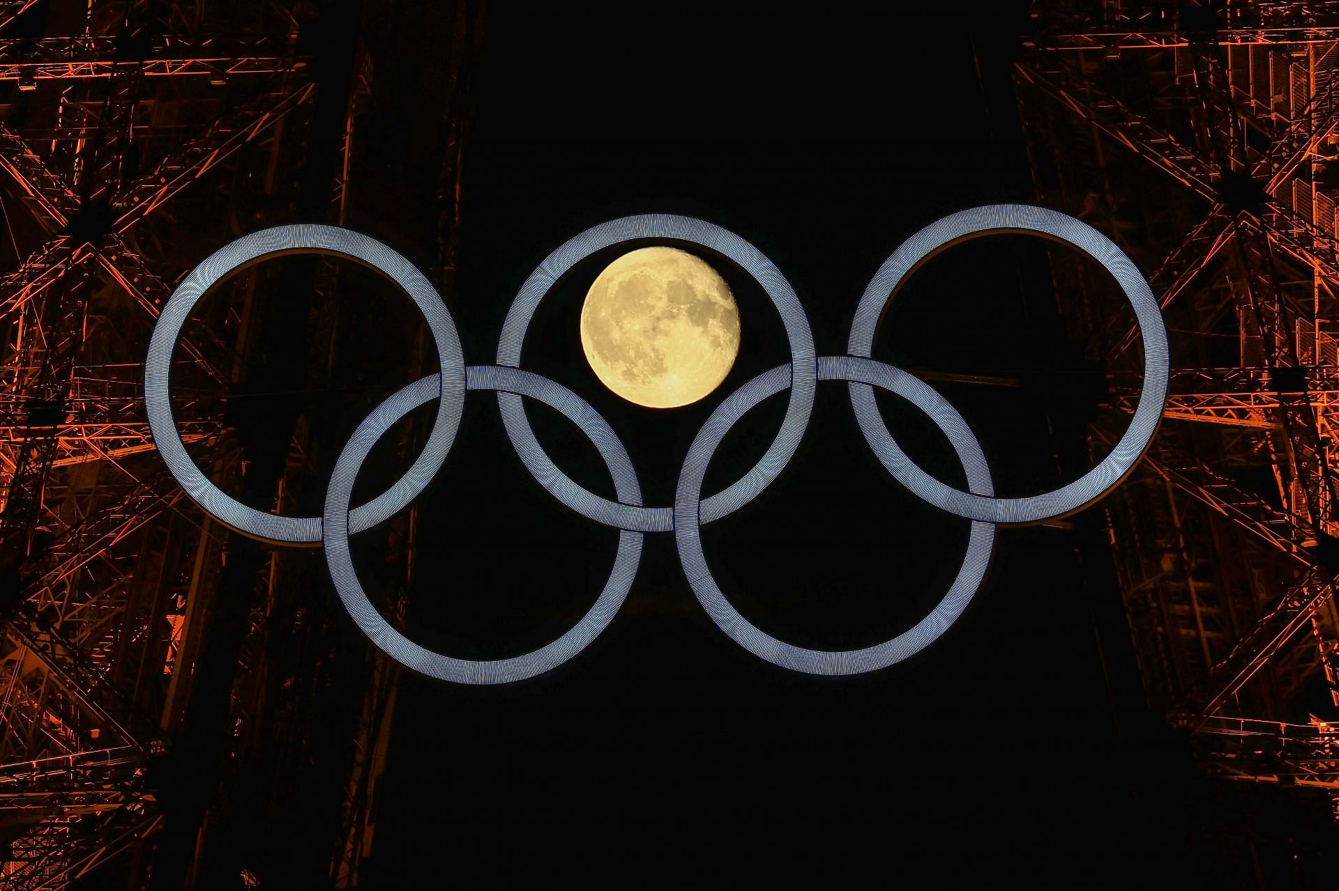 Moon aligning itself perfectly in between Paris Olympic 2024 rings at Eiffel Tower - Image by Getty Images