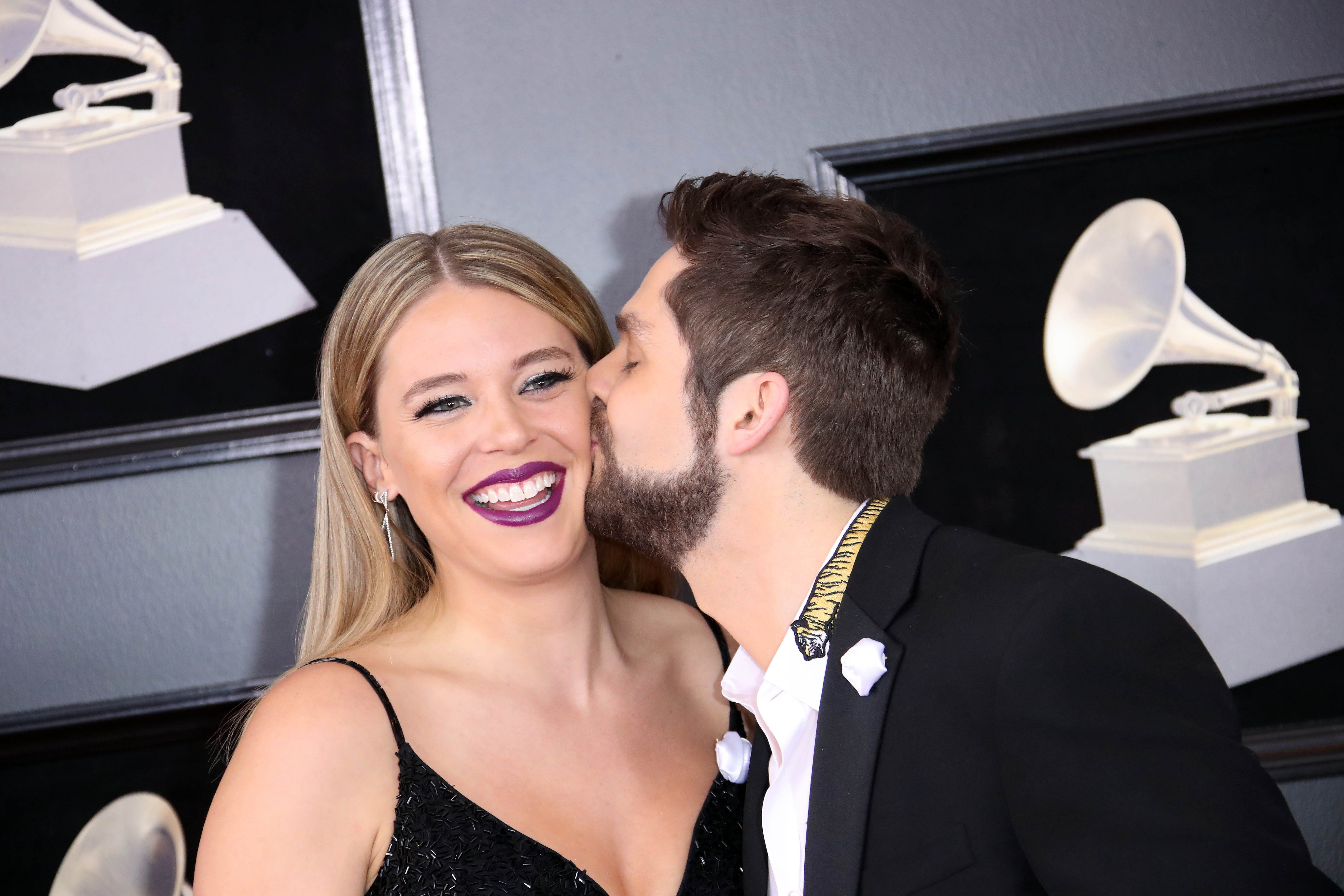 Lauren Akins (L) and Thomas Rhett arrive at the 60th Annual Grammy Awards - Source: Imagn