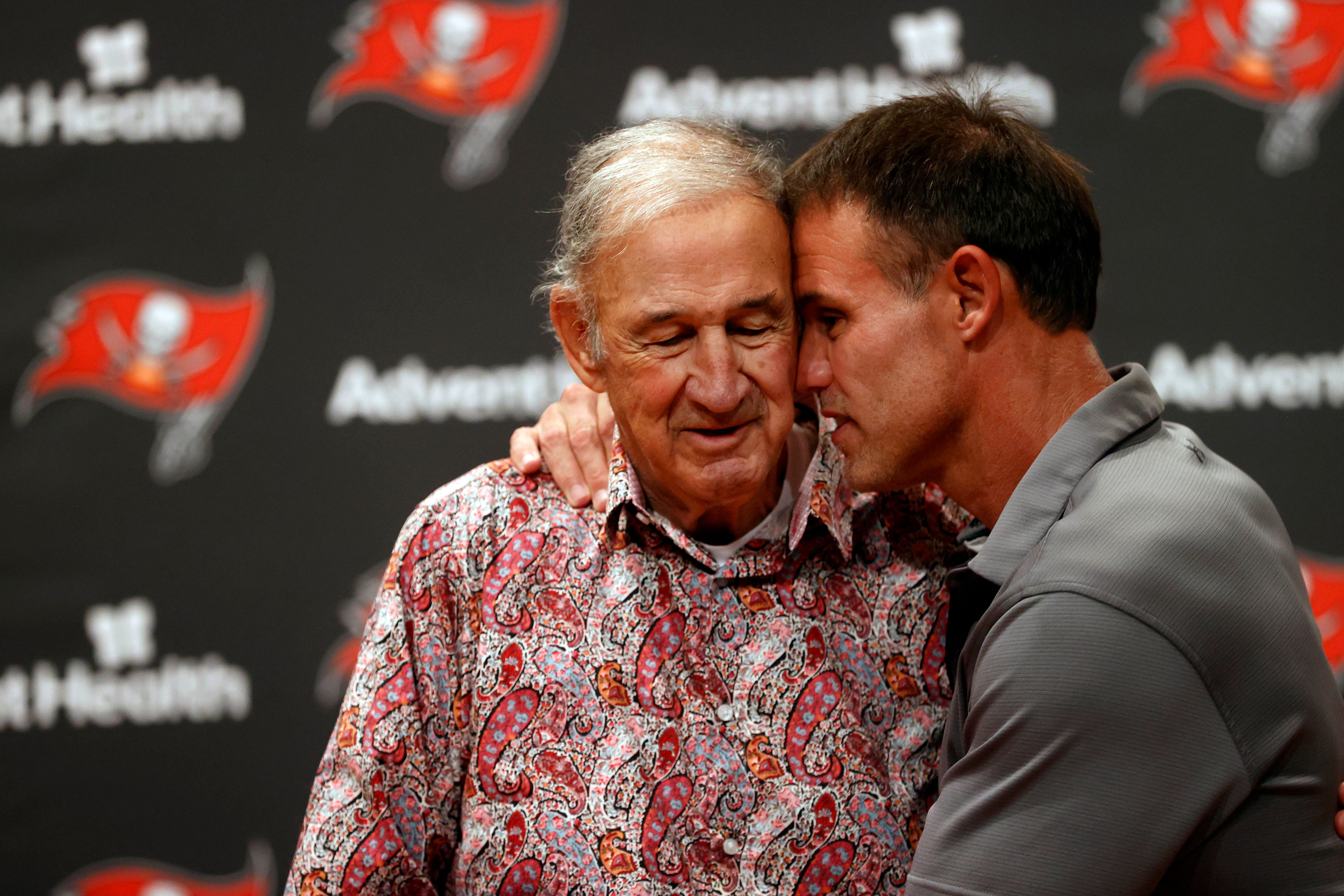 Tampa Bay Buccaneers former defensive coordinator Monte Kiffin (left) and former player Mike Alstott (right) react during a press conference. (image credit: IMAGN)