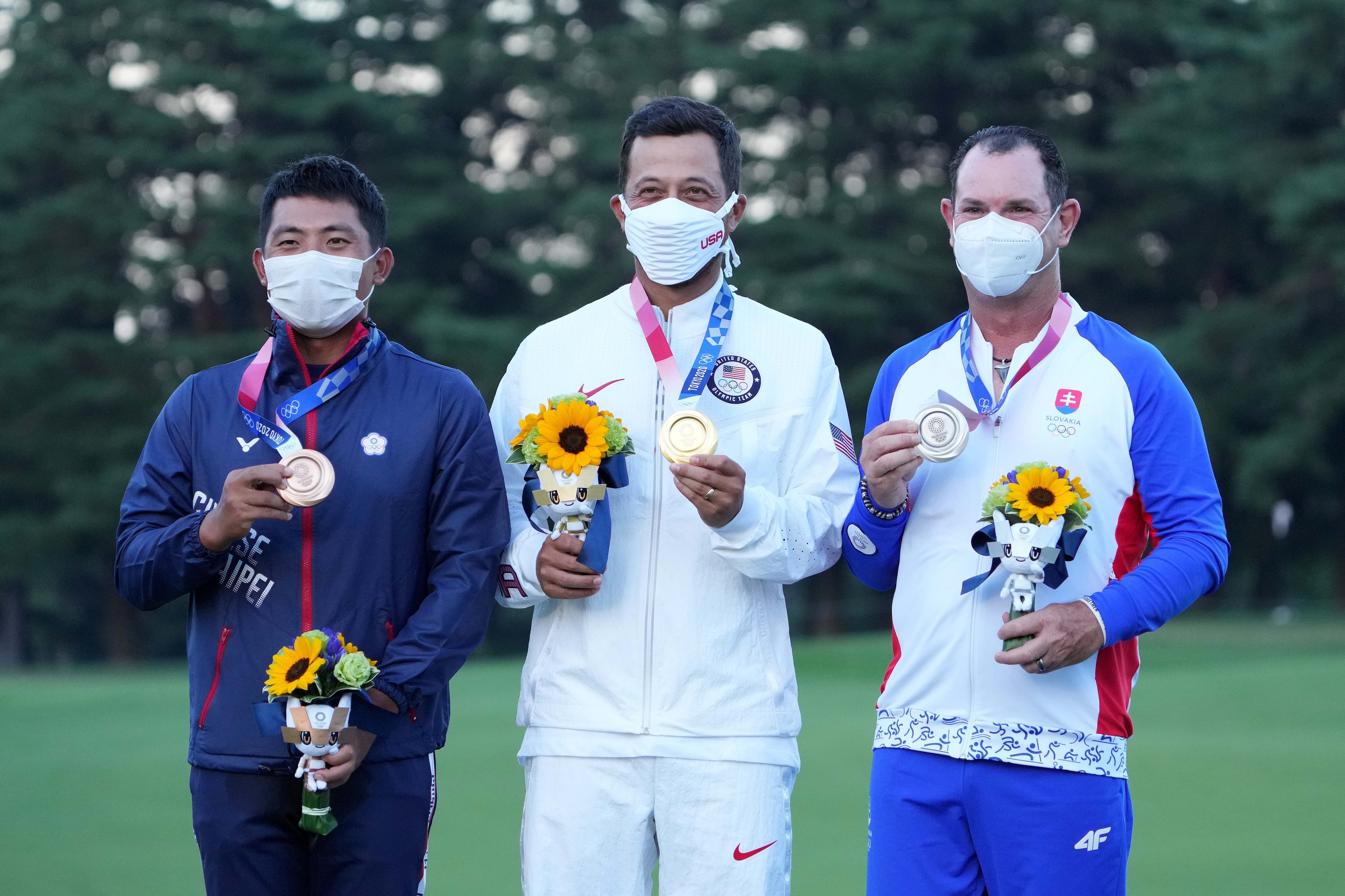 The winners of the Tokyo Olympics men&#039;s golf event. (Image via: IMAGN)