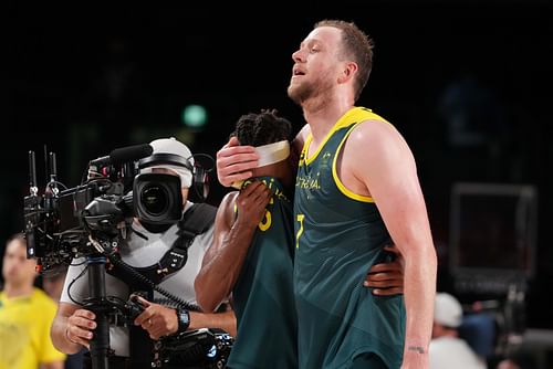 Australia point guard Patty Mills and small forward Joe Ingles celebrate after winning the bronze medal at the Tokyo 2020 Olympics. Photo Credit: Imagn