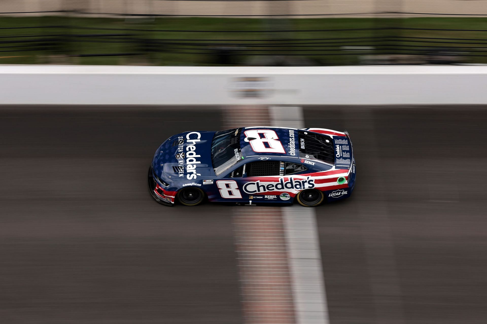 Kyle Busch, driver of the #8 Cheddar&#039;s Patriotic Chevrolet, drives during the NASCAR Cup Series Brickyard 400 at Indianapolis Motor Speedway on July 21, 2024, in Indianapolis, Indiana. (Photo by James Gilbert/Getty Images)