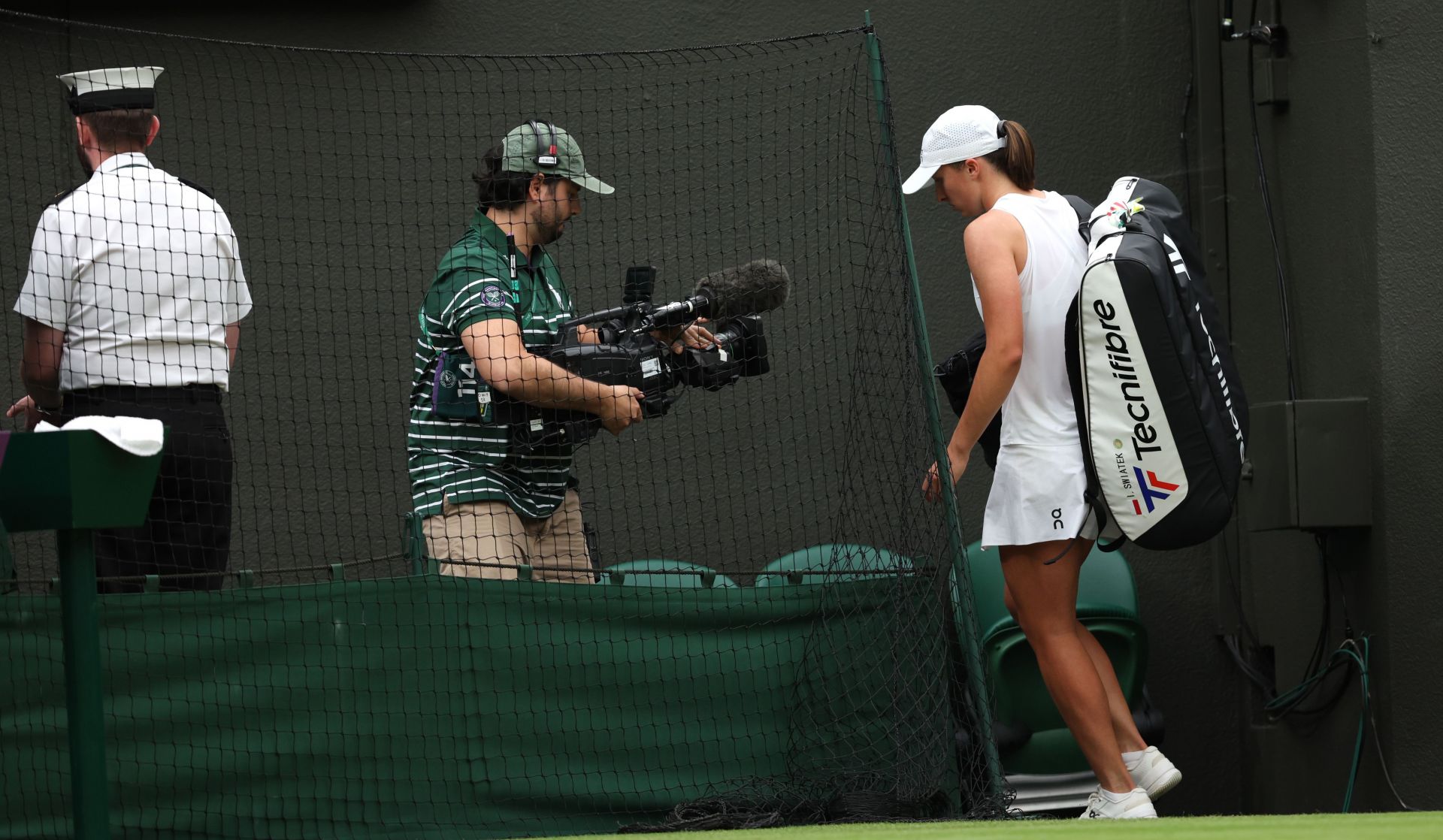 Iga Swiatek leaves the Centre Court after losing to Yulia Putintseva at Wimbledon (IMAGE: GETTY)