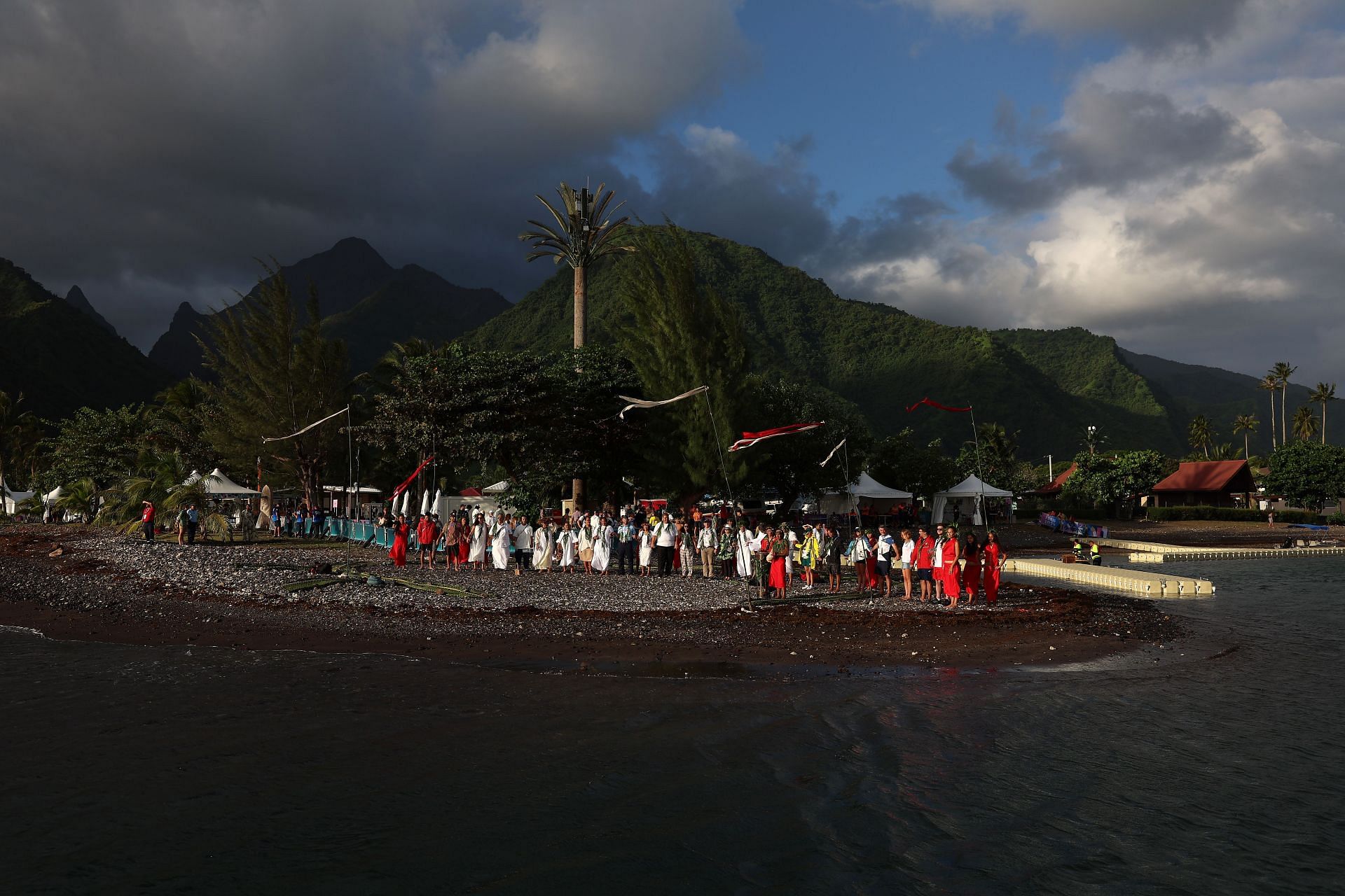 Locals participating at the opening ceremony of a surfing competiton in Teahupo&#039;o [Image Source: Getty]