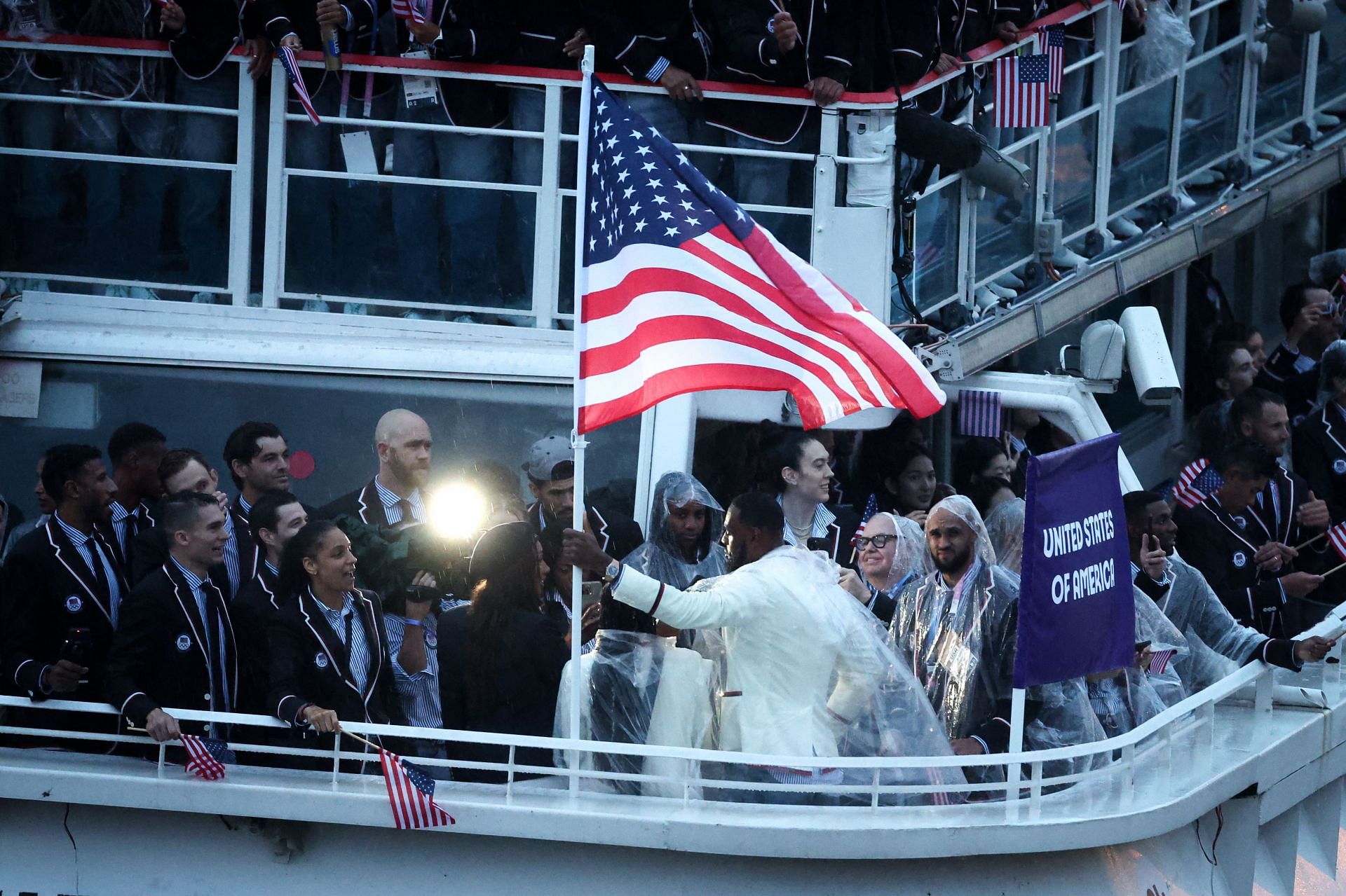 Lebron James, Flagbearer of Team United States, waves his country&#039;s flag on a boat on the River Seine during the opening ceremony of the Olympic Games Paris 2024 on July 26, 2024, in Paris, France. (Photo by Alex Pantling/Getty Images)