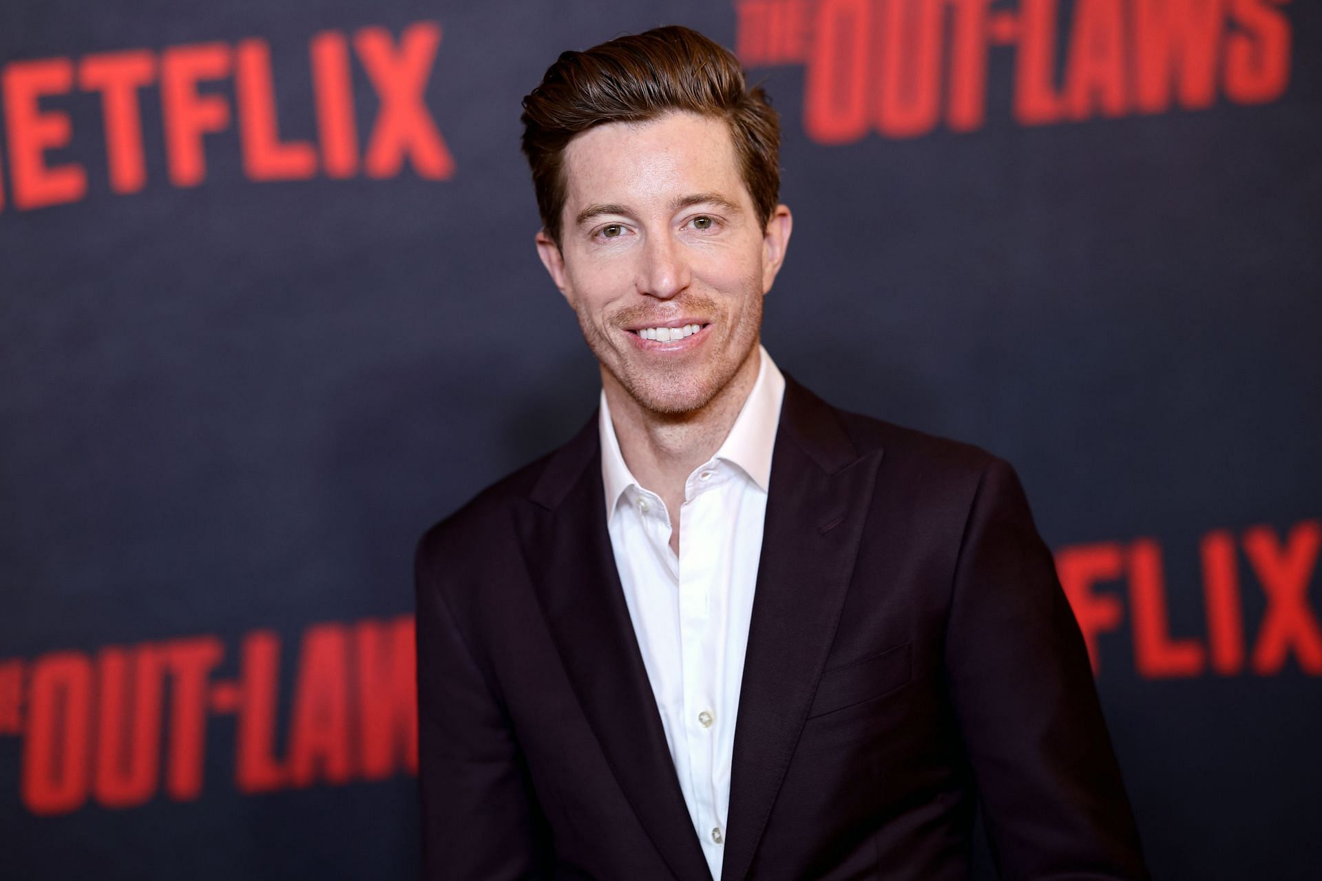 Shaun White is an American snowboarder and skateboarder who carried the Paris Olympics 2024 torch