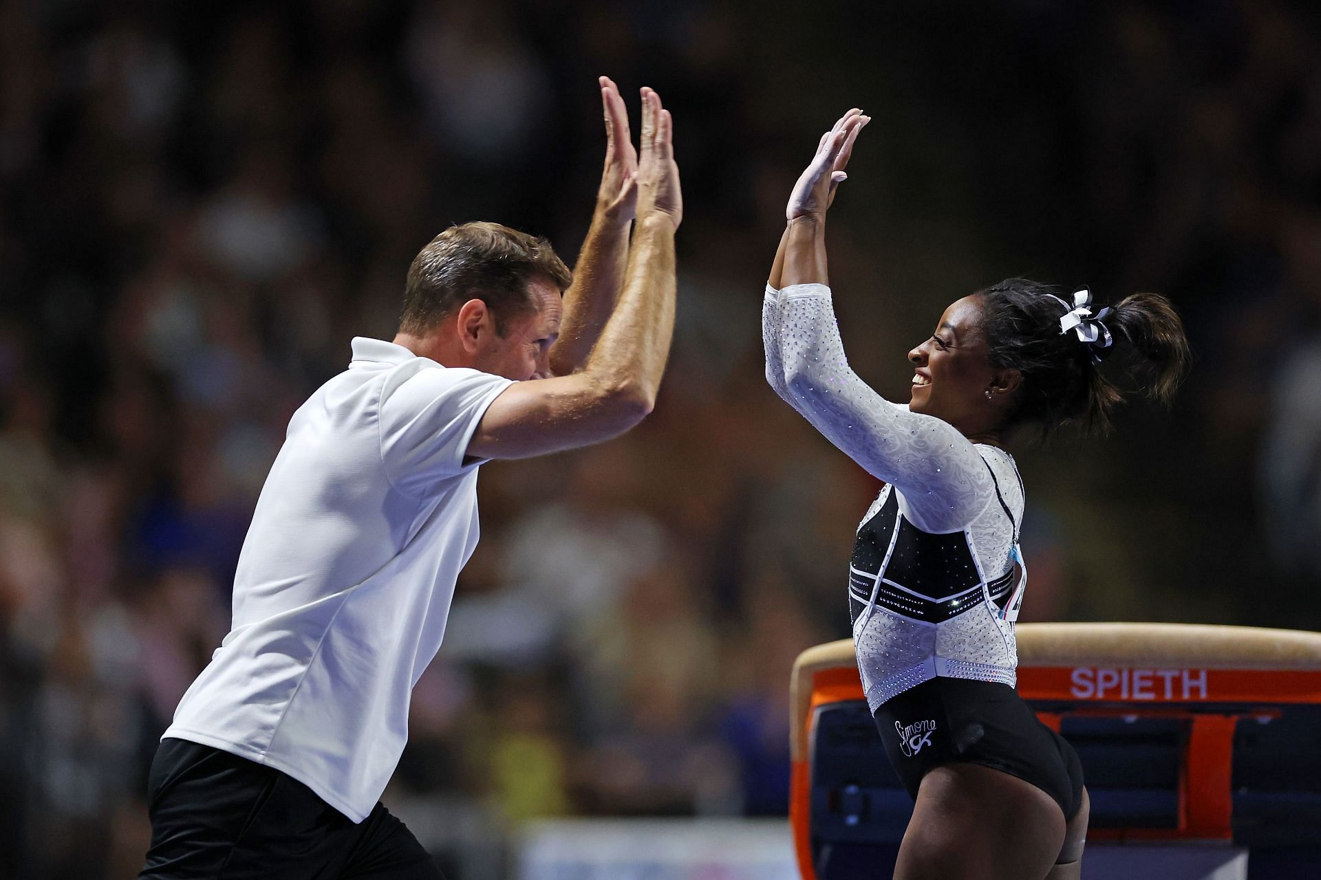 Simone Biles celebrates with her coach Laurent Landi