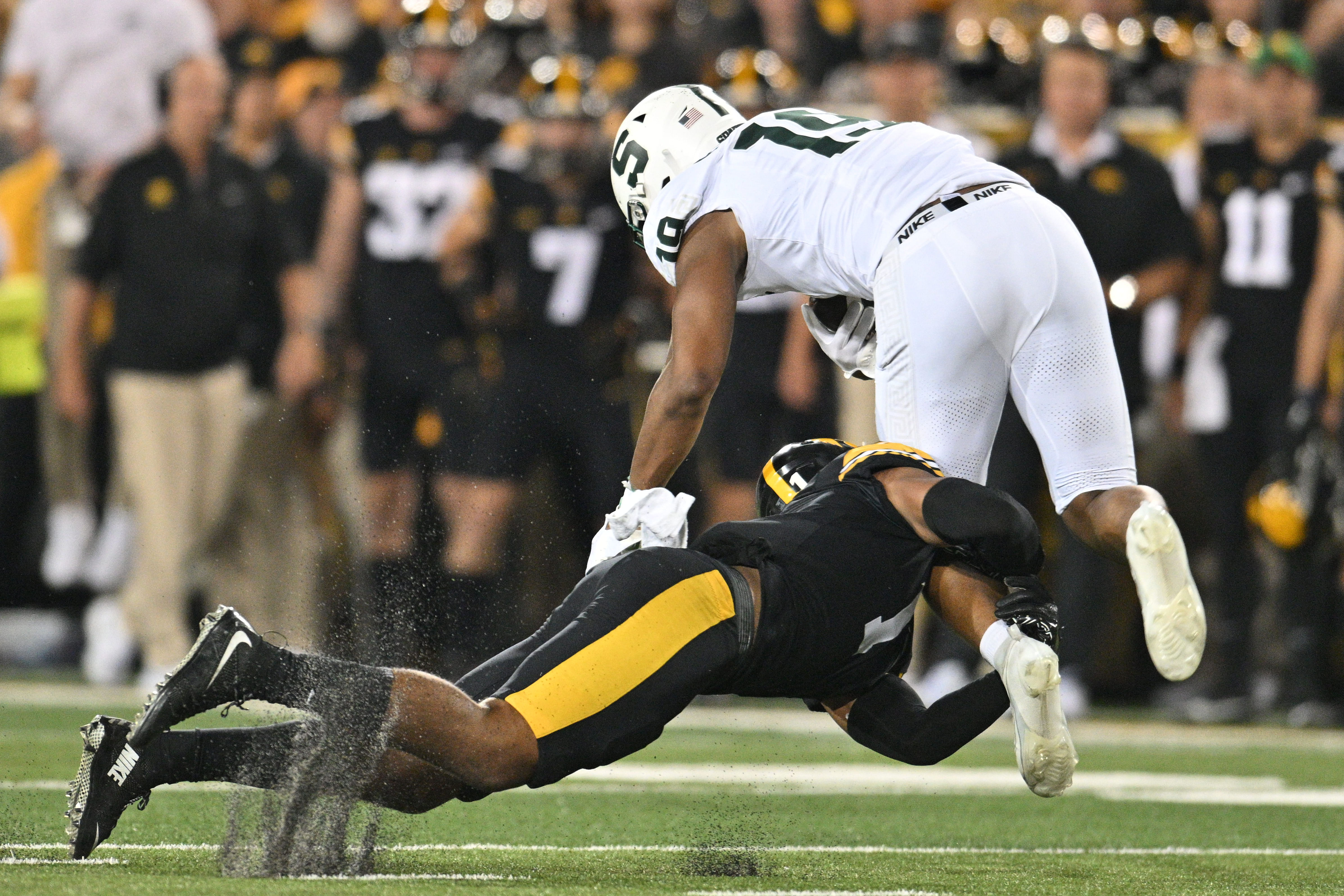 Iowa safety Xavier Nwankpa makes a tackle against Michigan State. - Source: Imagn