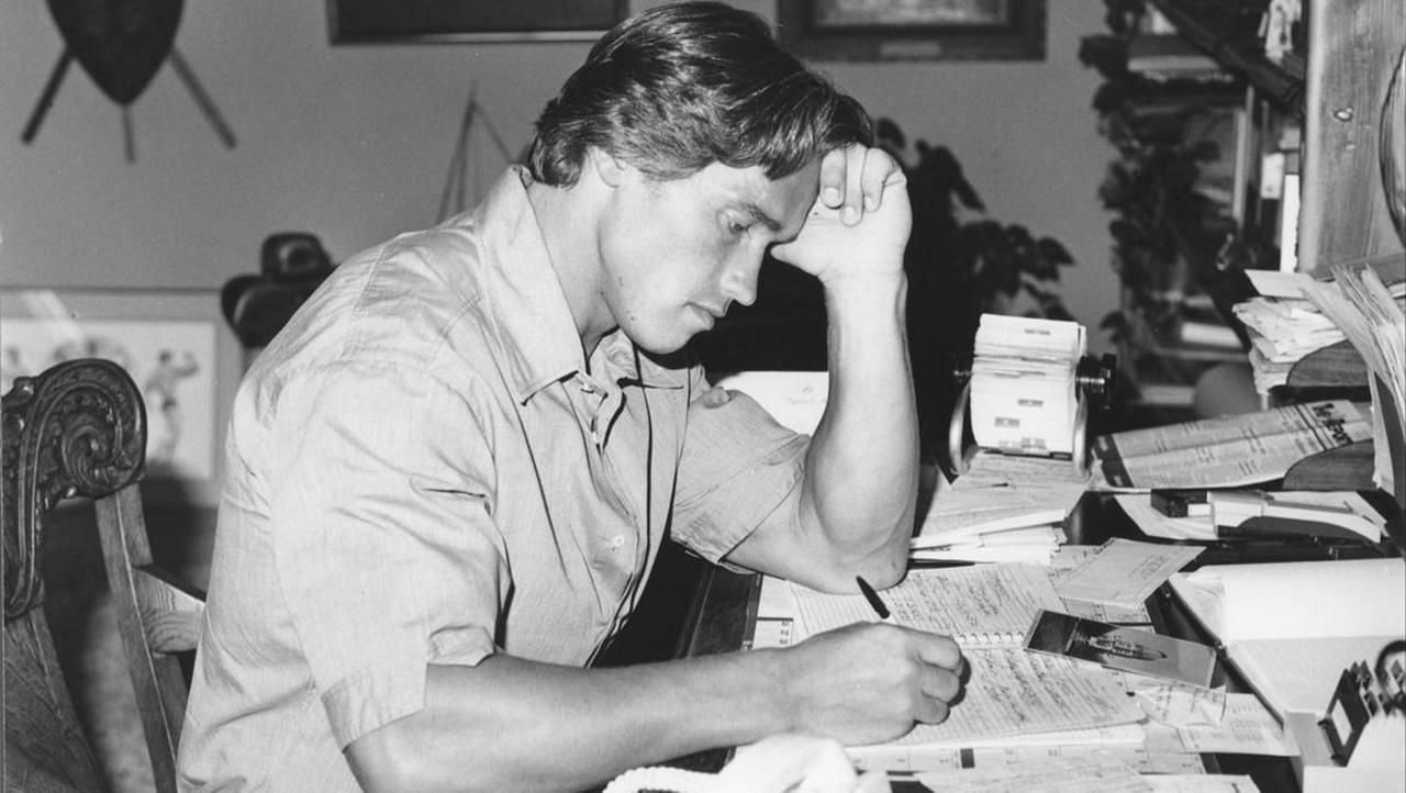 Arnold Schwarzenegger studying for his college degree