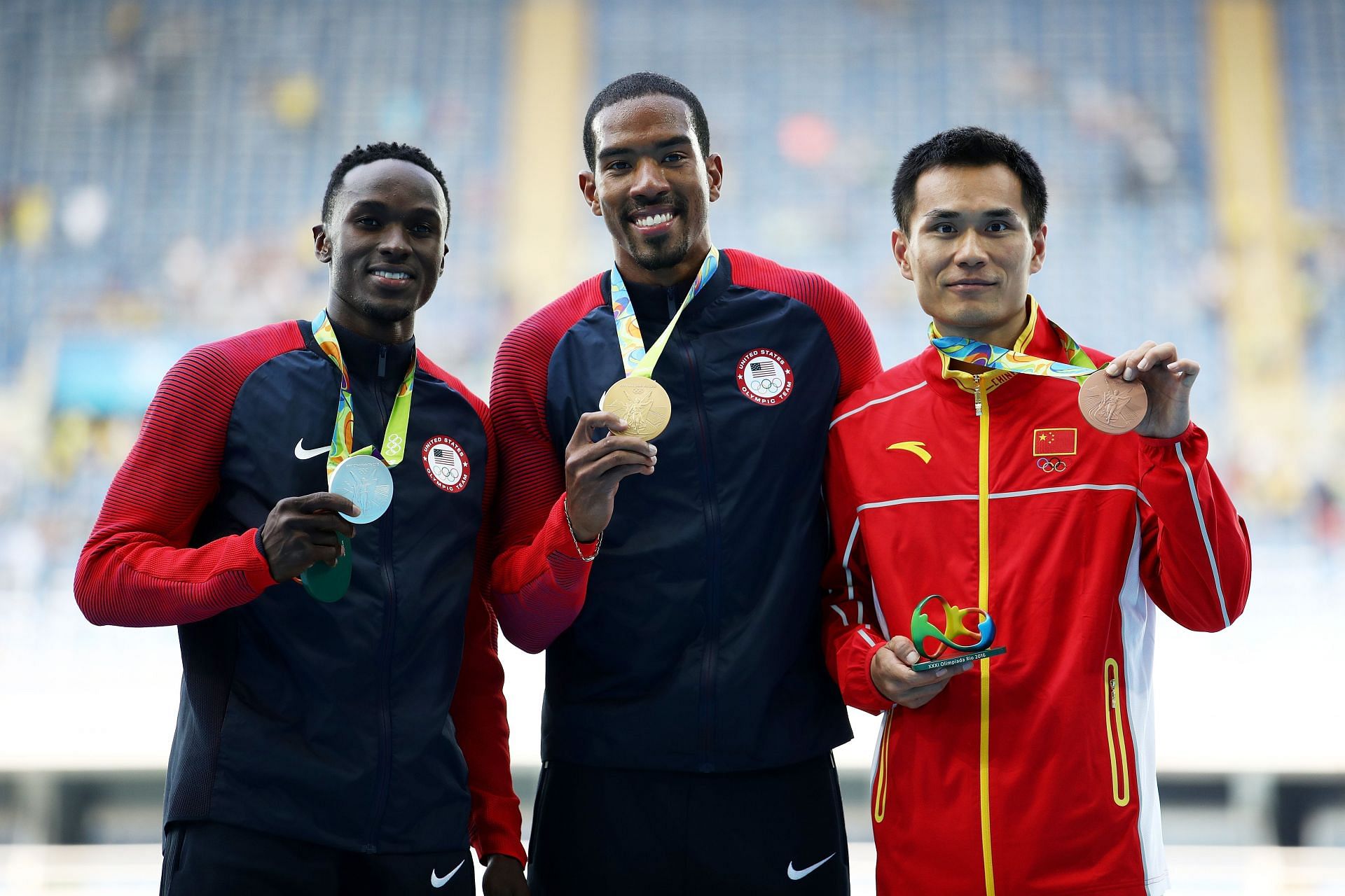 Christian Taylor [C] with other medalists at the Rio Olympics