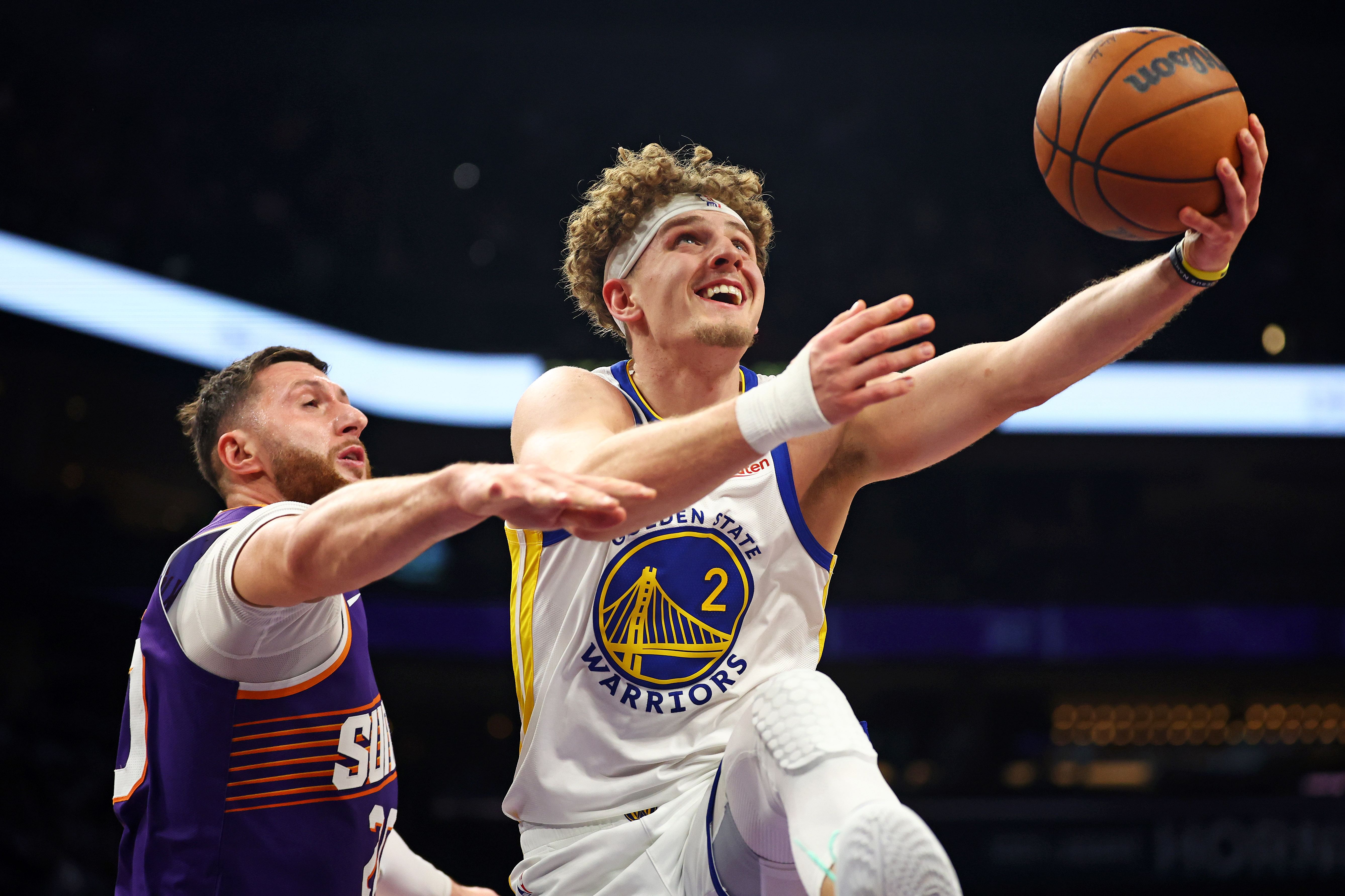 Golden State Warriors guard Brandin Podziemski shoots the ball against Phoenix Suns center Jusuf Nurkic Photo Credit: Mark J. Rebilas-USA TODAY Sports/Imagn