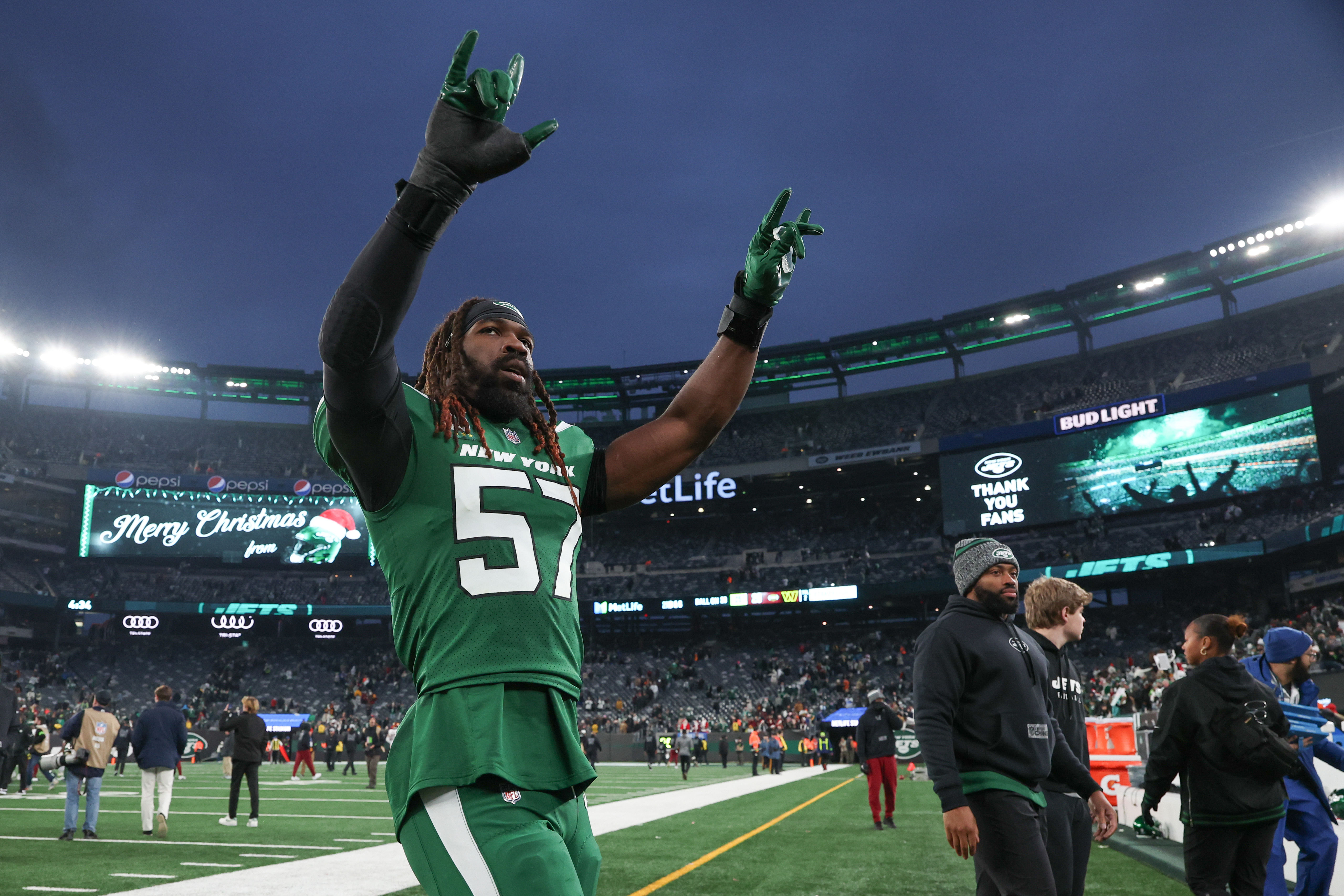 New York Jets linebacker C.J. Mosley (57) gestures to fans