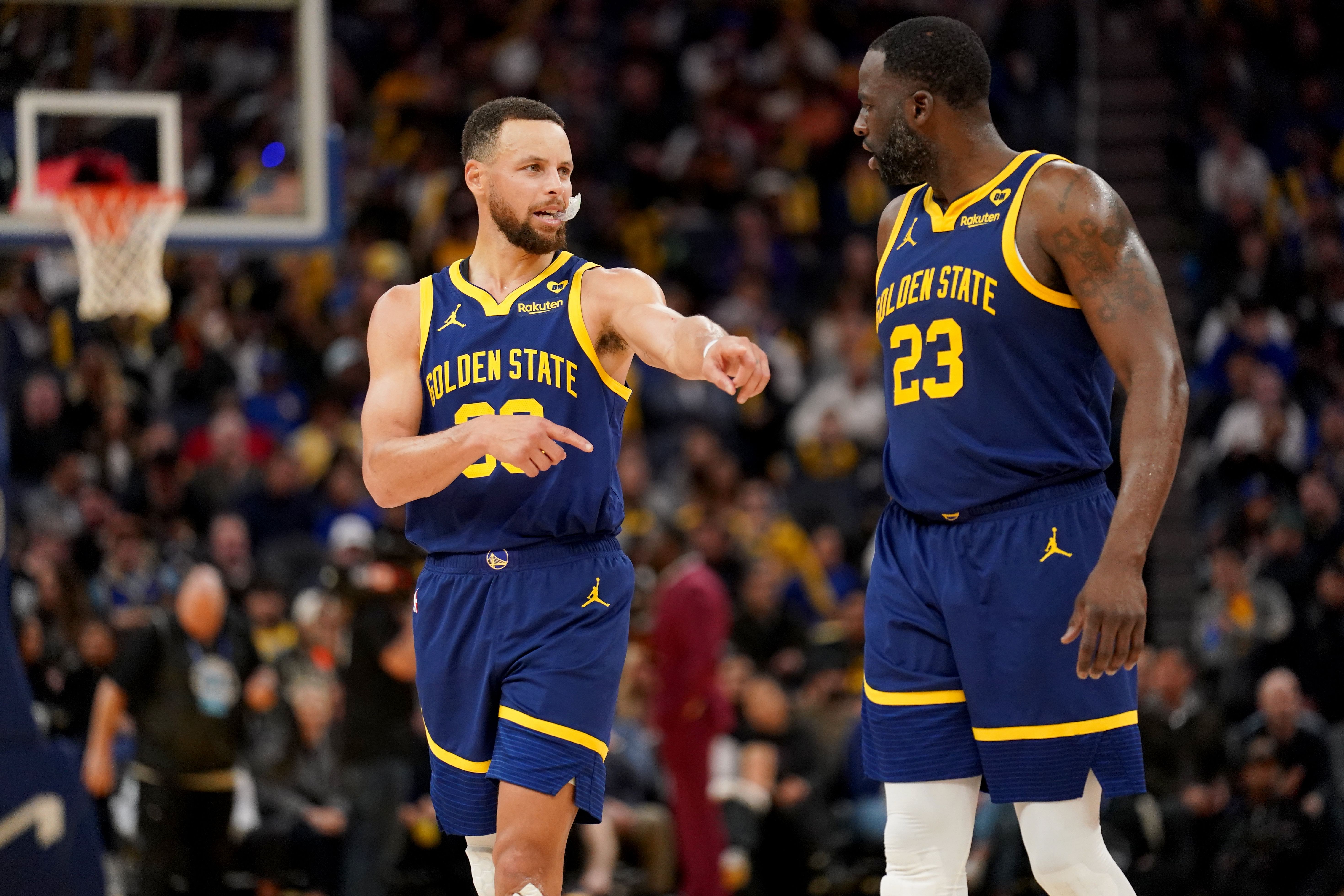 Golden State Warriors guard Stephen Curry and forward Draymond Green (Imagn)