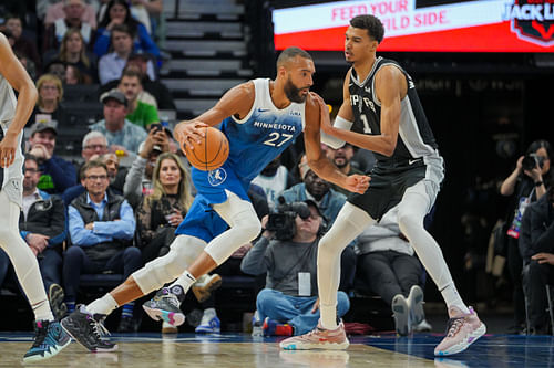 Rudy Gobert dribbles against Victor Wembanyama in the fourth quarter at Target Center. Photo Credit: Imagn